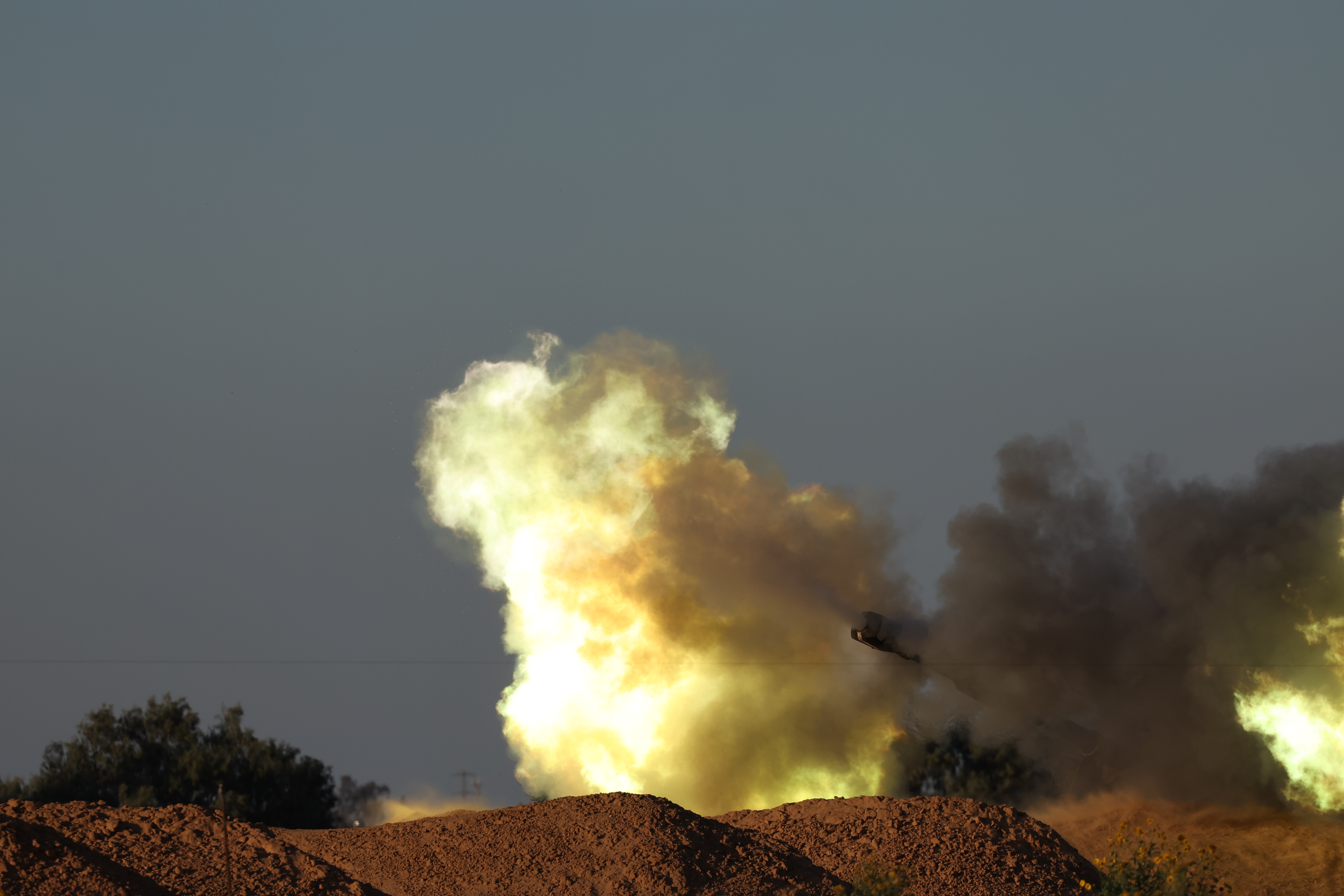 Israeli troops gather near the border with the Gaza Strip