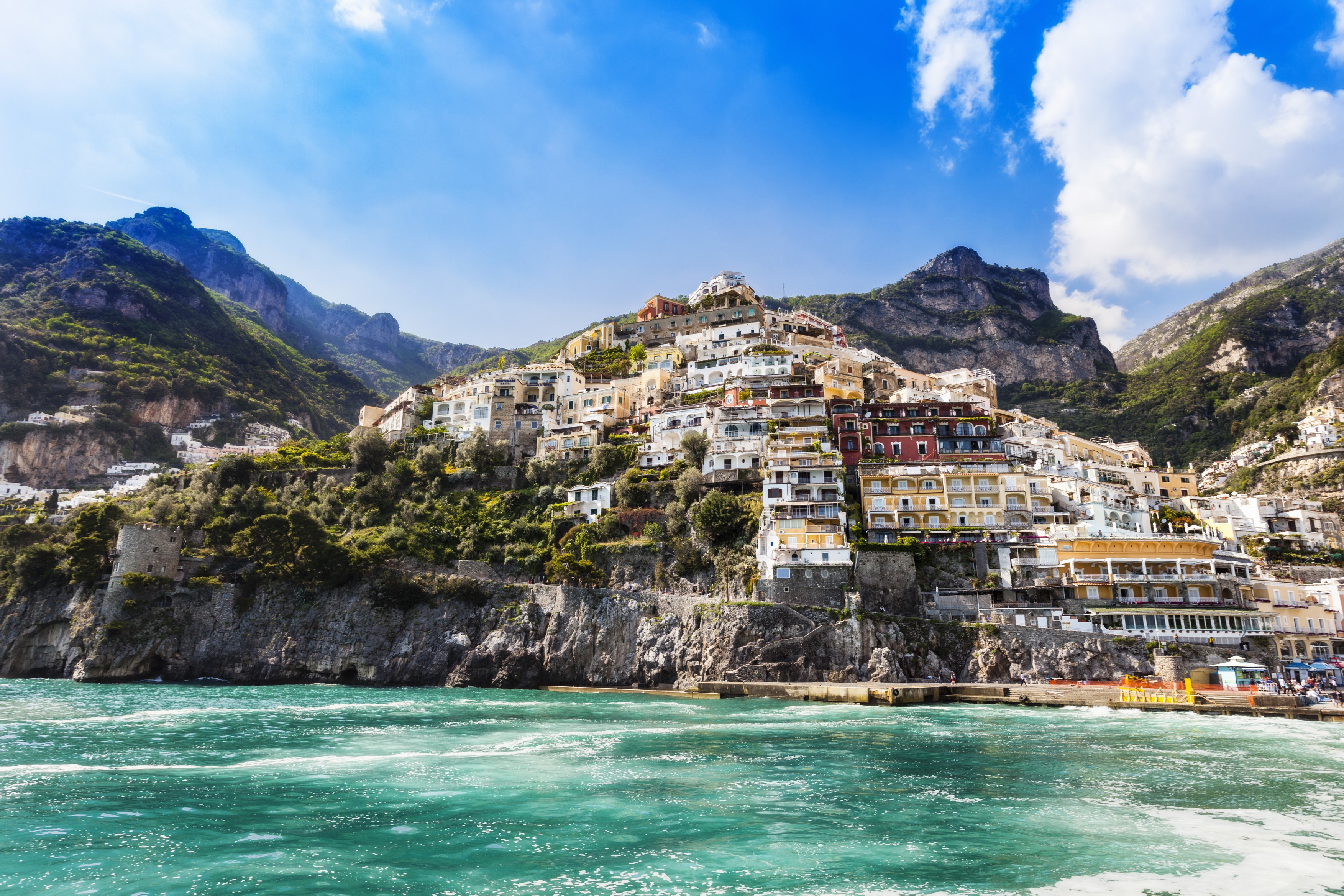 Cliff side buildings by sea, Positano, Amalfi Coast, Italy