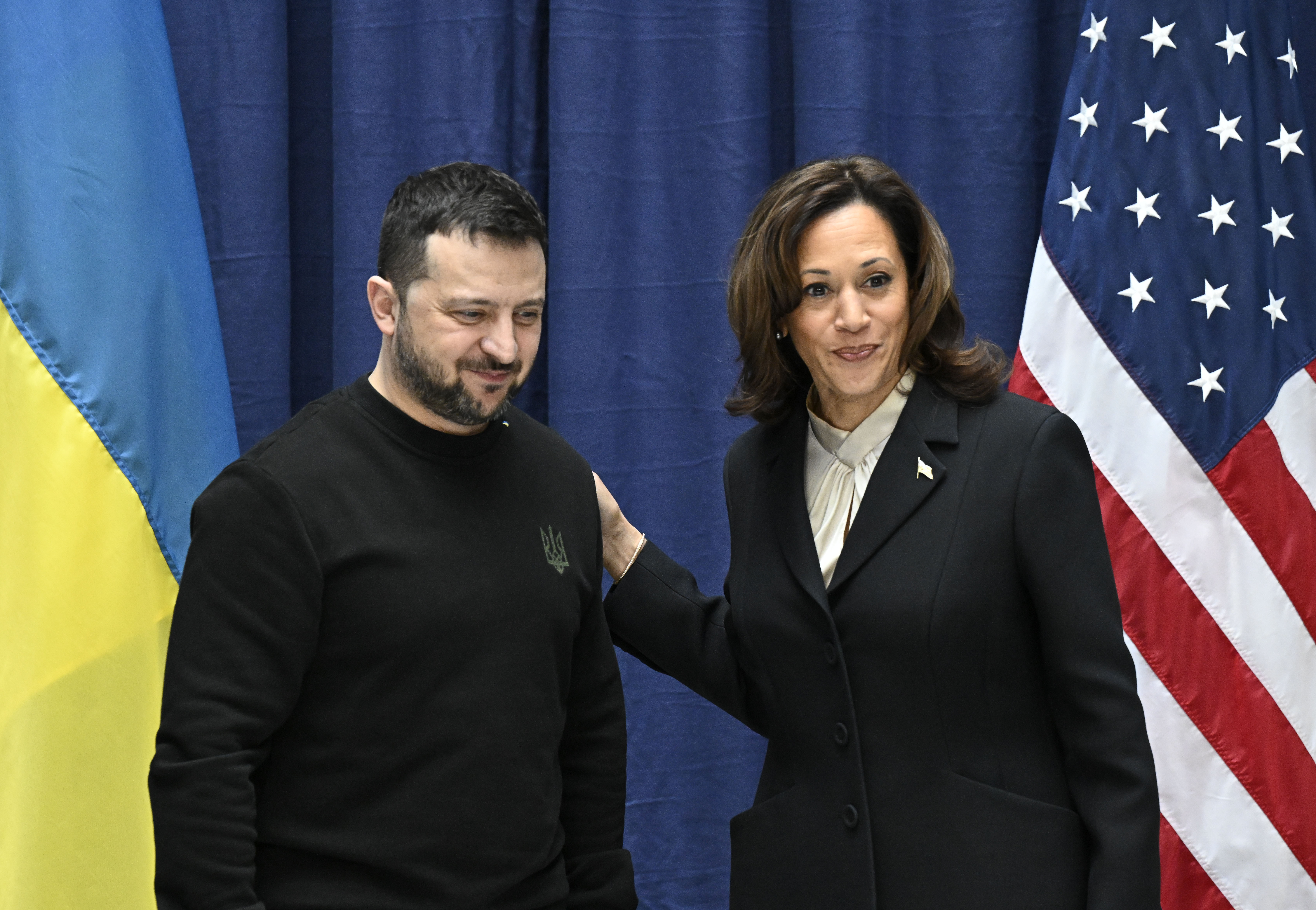 Ukrainian President Volodymyr Zelenskyy, left, and US Vice President Kamala Harris pose for pictures at the end of a press conference at the Munich Security Conference (MSC) in Munich, Germany, Saturday Feb. 17, 2024. (Tobias Schwarz/Pool via AP)