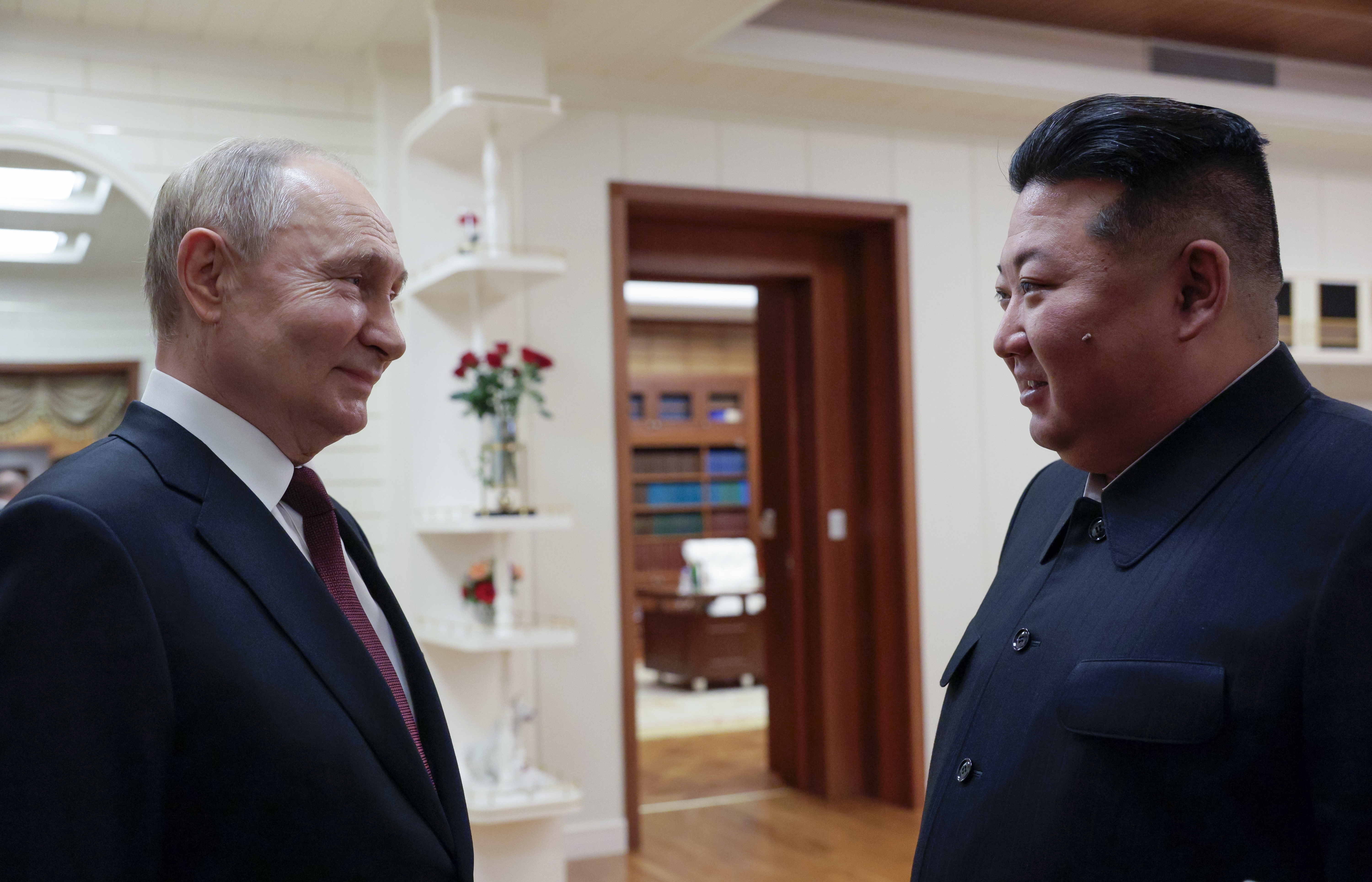 Russian President Vladimir Putin, left, and North Korea's leader Kim Jong Un talk to each other during their meeting in Pyongyang, North Korea, on Tuesday, June 18, 2024. (Gavriil Grigorov, Sputnik, Kremlin Pool Photo via AP)