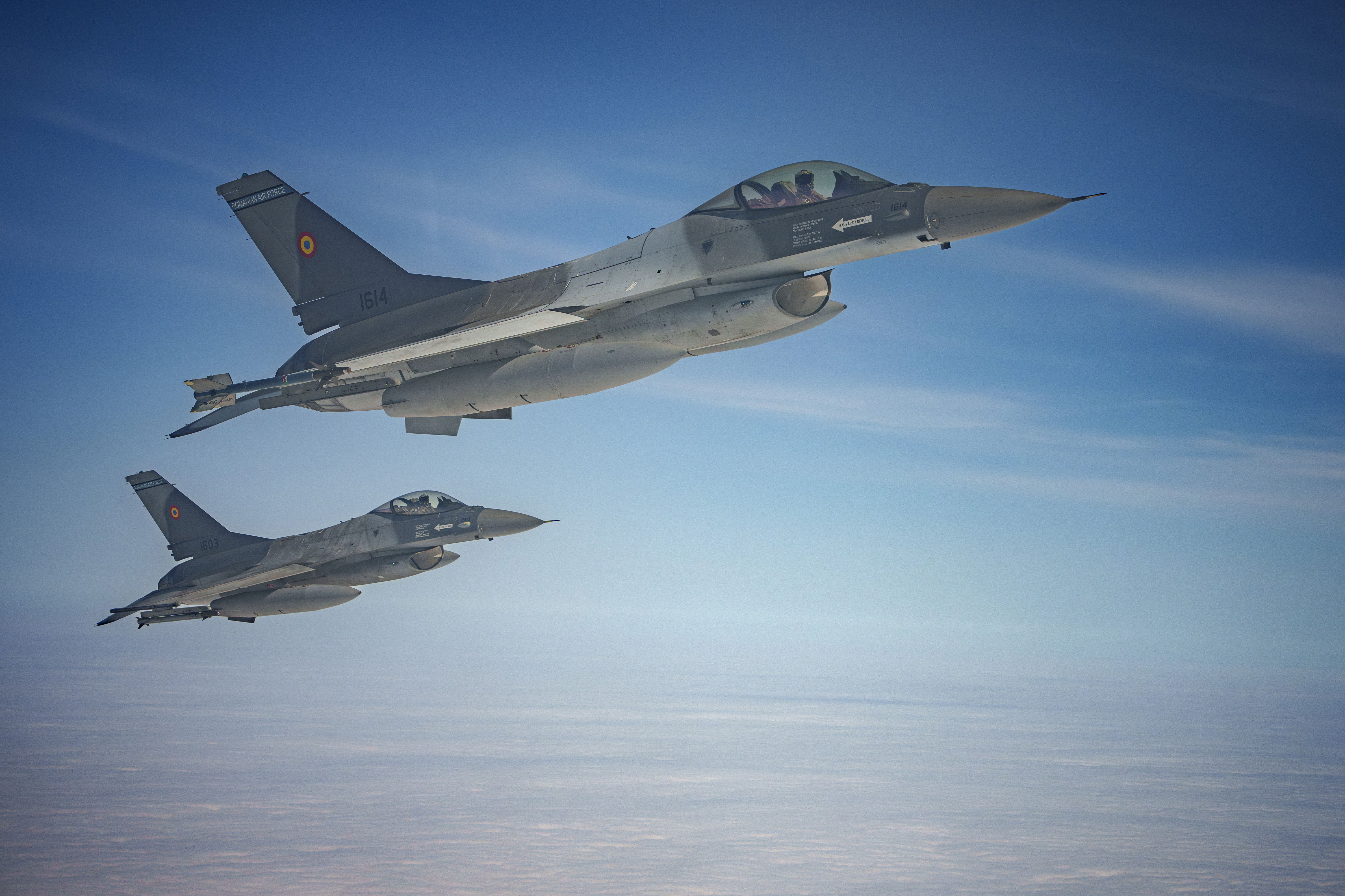 Romanian Air Force F-16s military fighter jets escort a C-27J Spartan aircraft during an Air Policing exercise above eastern Romania, Wednesday, March 6, 2024. (AP Photo/Andreea Alexandru)