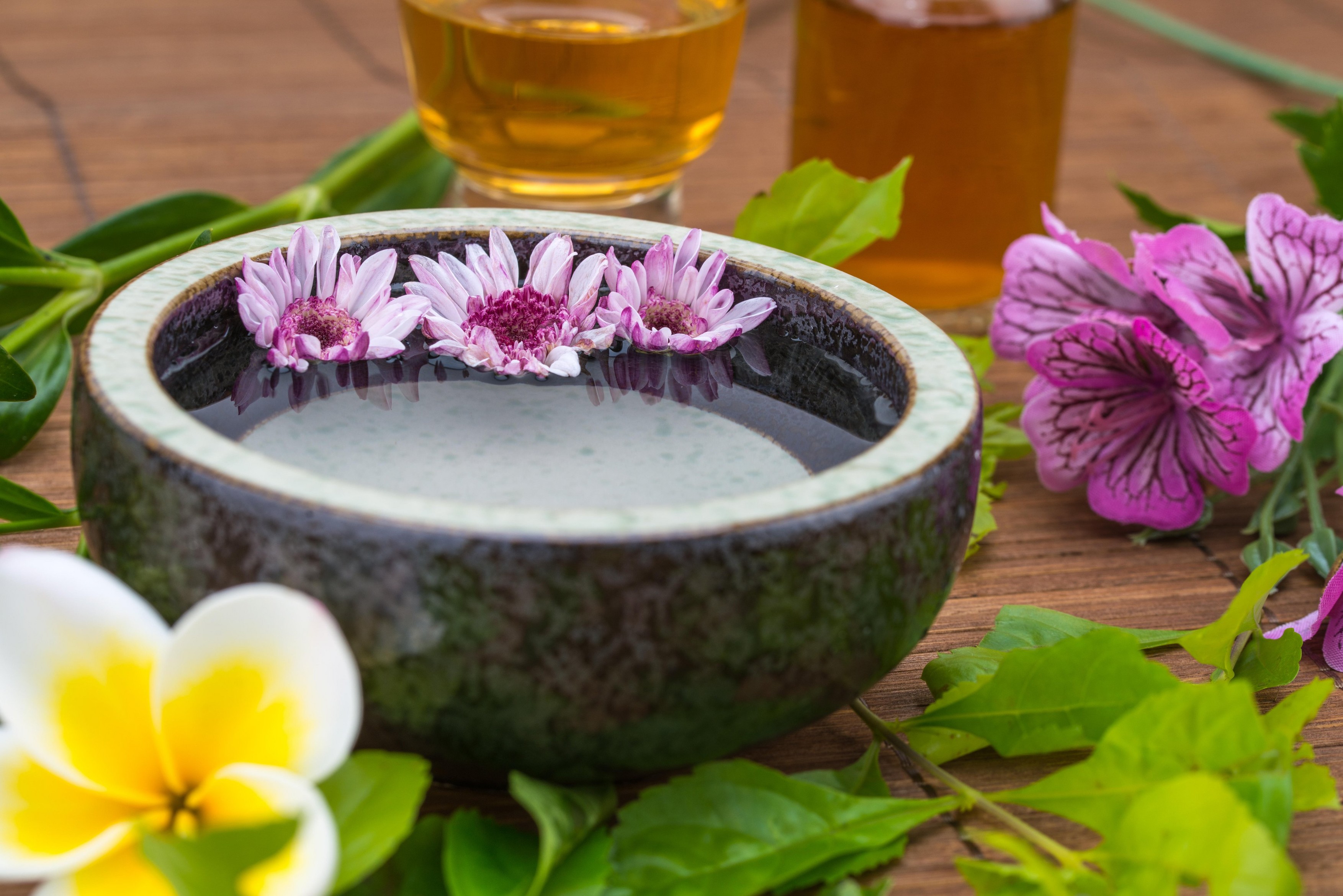flower float on water bowl with essential oil for health spa
