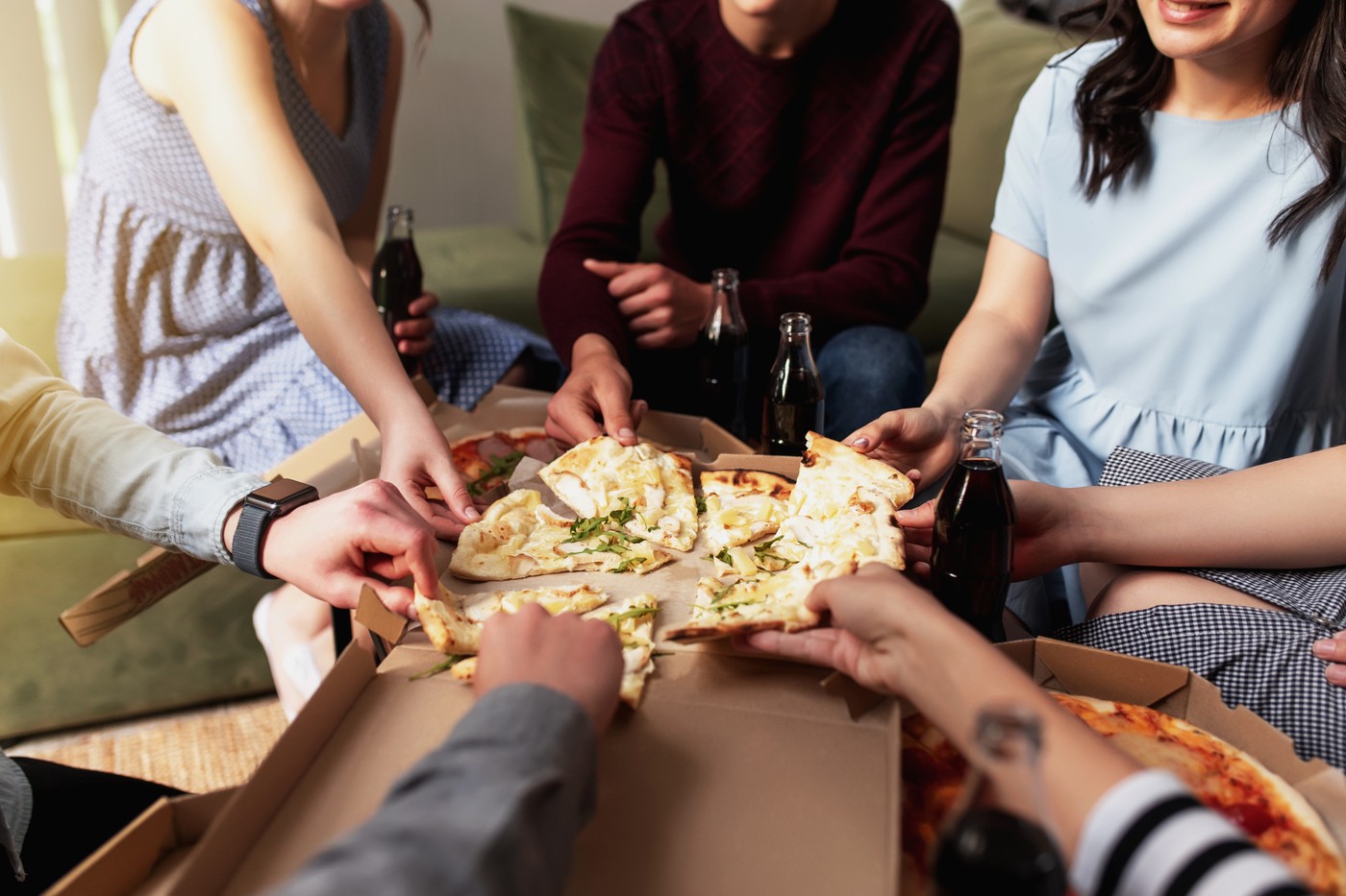 Pizza party, group of friends chatting, eating pizza, drinking sweet soda water