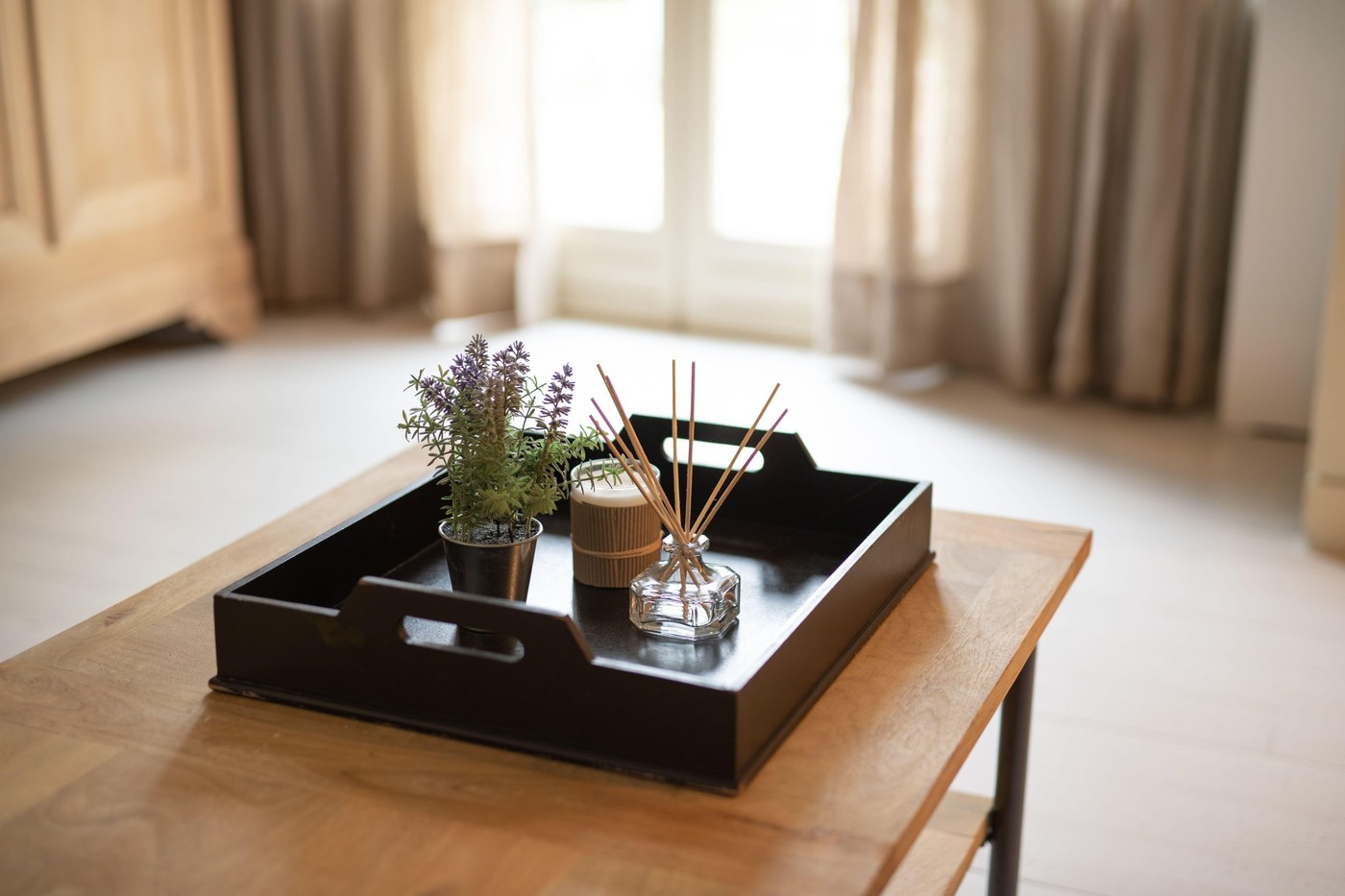 decorative items on a coffee table inside a naturally lit room