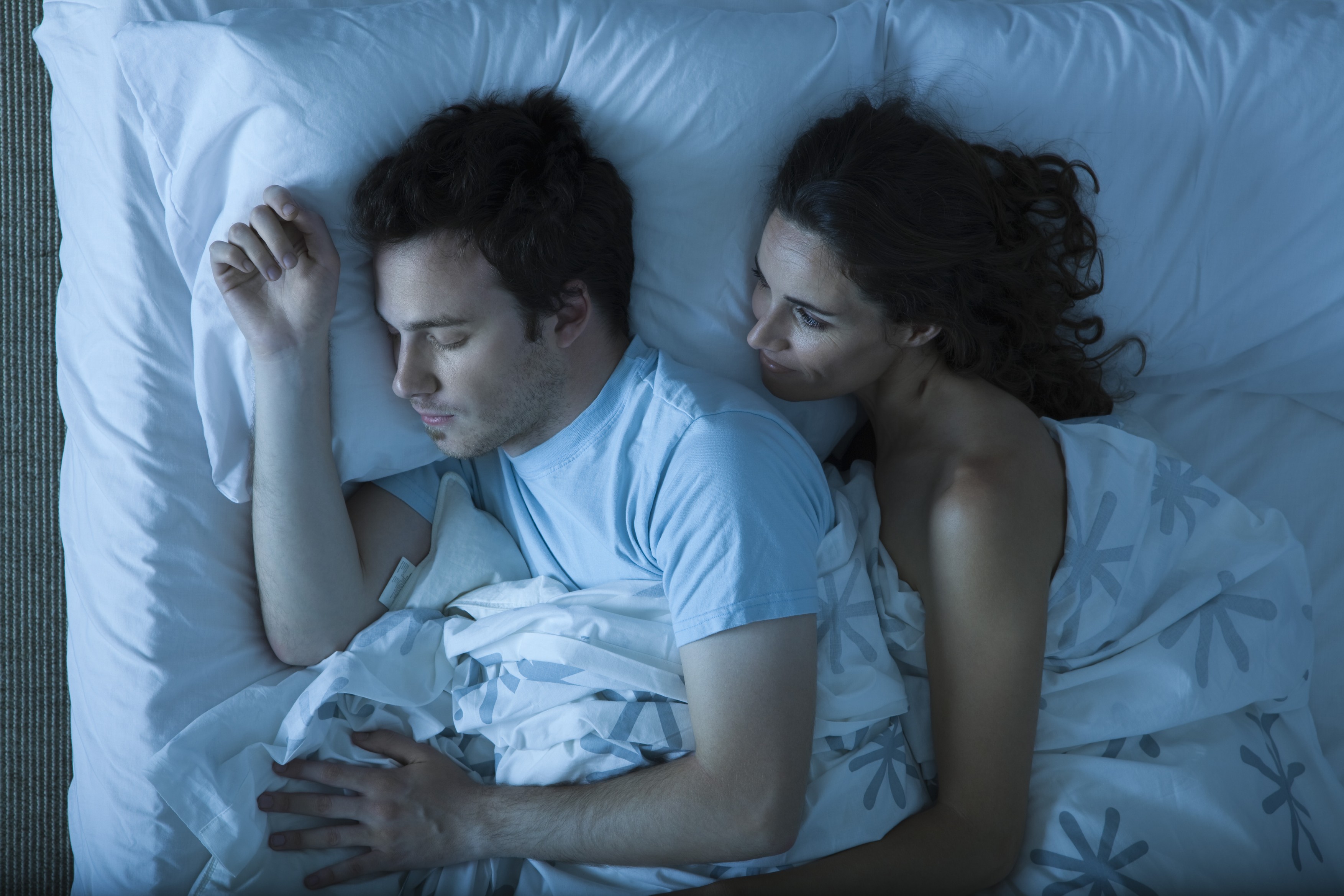 Couple together in bed, woman embracing man, watching him sleep,Image: 71548718, License: Royalty-free, Restrictions: , Model Release: yes, Credit line: Frederic Cirou / PhotoAlto / Profimedia