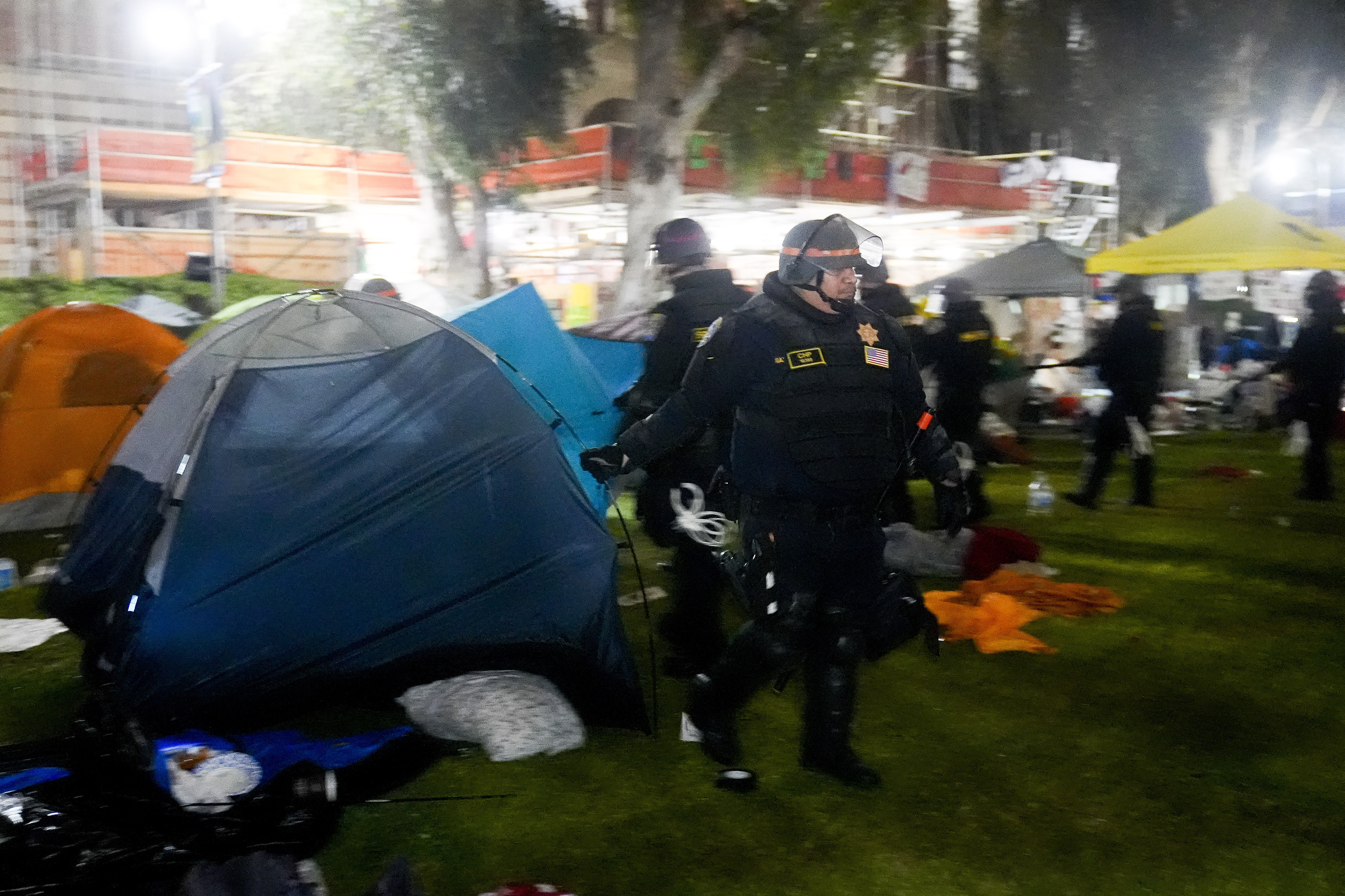 Police break up an pro-Palestinian encampment on the UCLA campus Thursday, May 2, 2024, in Los Angeles. (AP Photo/Jae C. Hong)