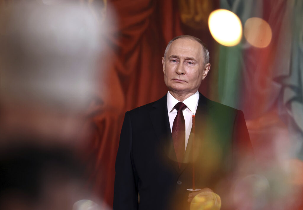 Russian President Vladimir Putin attends the Orthodox Easter service at the Cathedral of Christ the Saviour in Moscow, Russia, Sunday, May 5, 2024. (Valeriy Sharifulin, Sputnik, Kremlin Pool Photo via AP)
