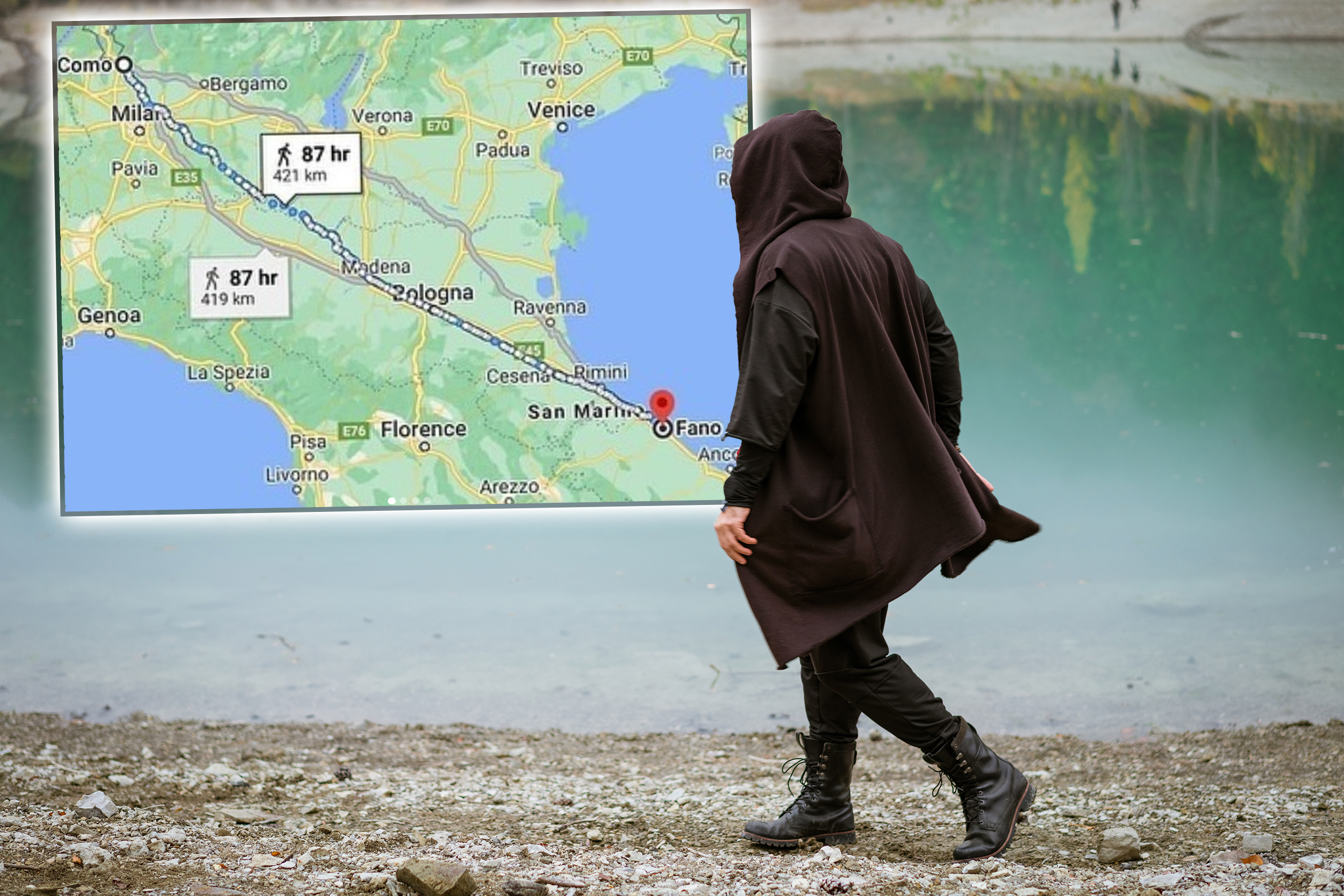 A man in a sweatshirt with a hood walks alone on the beach by a calm lake, in a wooded area somewhere in the mountains. Camping hiking, active lifestyle concept.