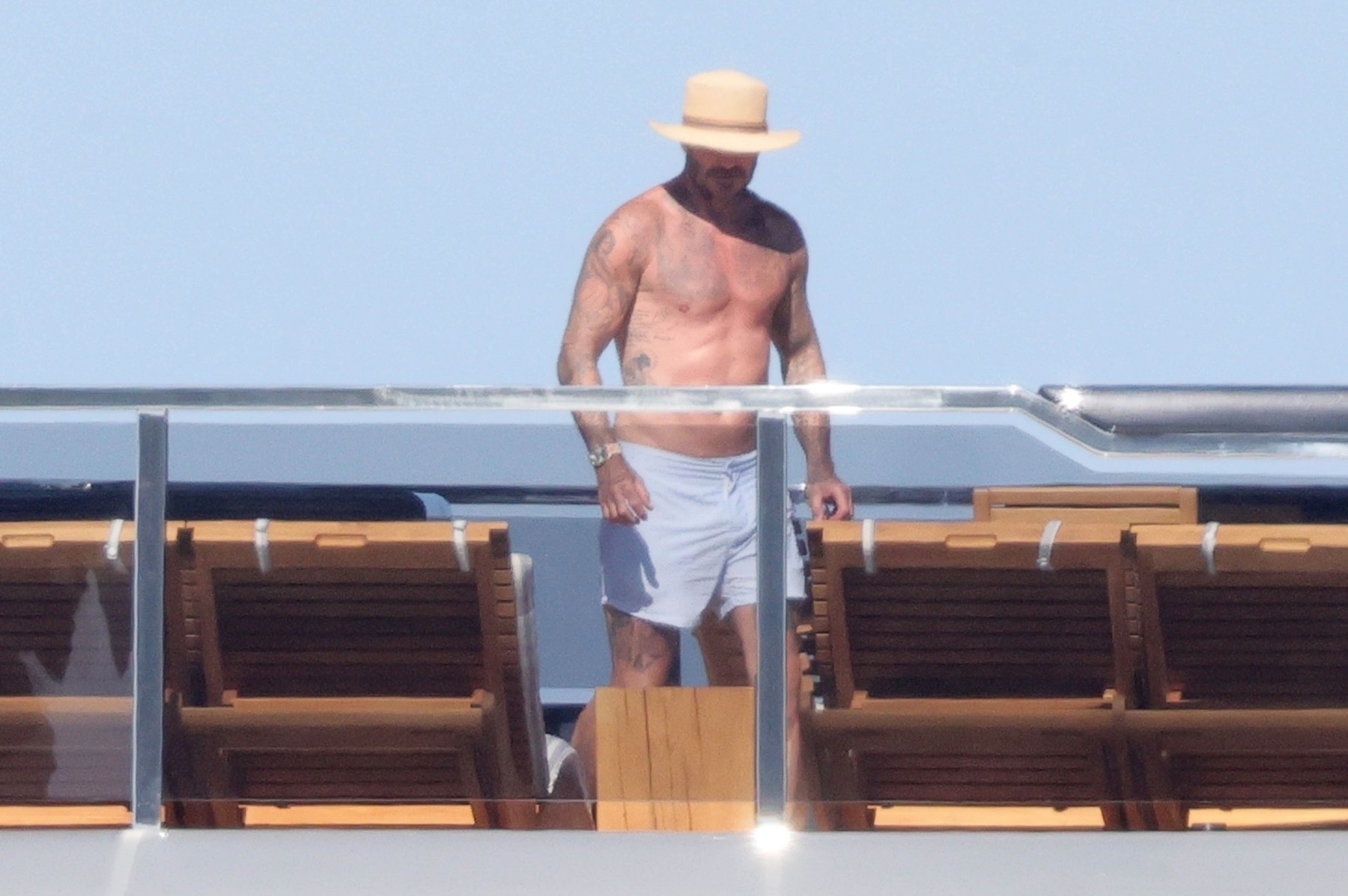 *PREMIUM-EXCLUSIVE* MUST CALL FOR PRICING BEFORE USAGE - On the eve of England's day of destiny where they will play the Netherlands in the semi-finals of Euro 2024, the Former England Captain David Beckham chills out in the Italian sunshine on his family