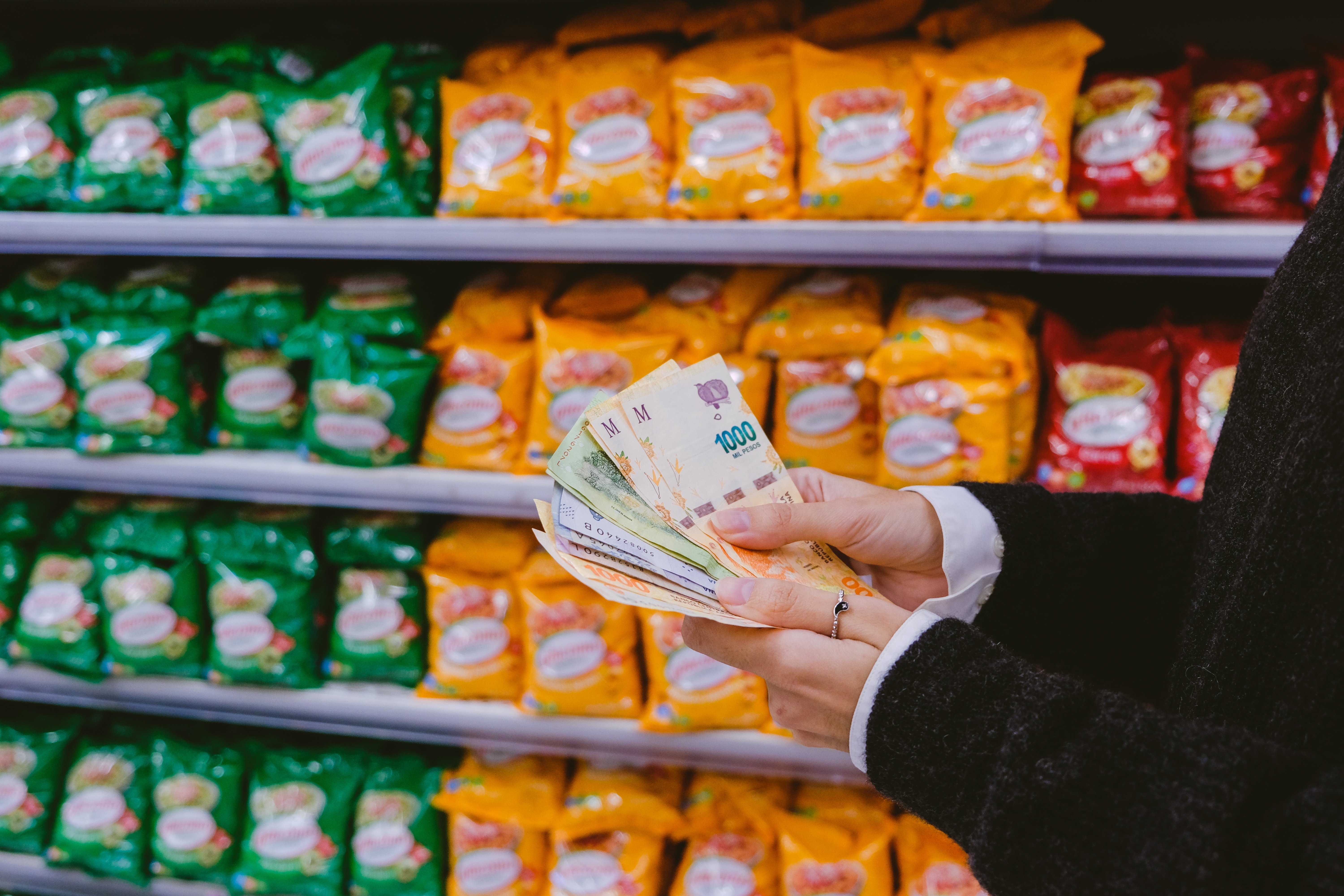 Woman,Counting,Money,-argentine,Pesos-,In,The,Supermarket.
