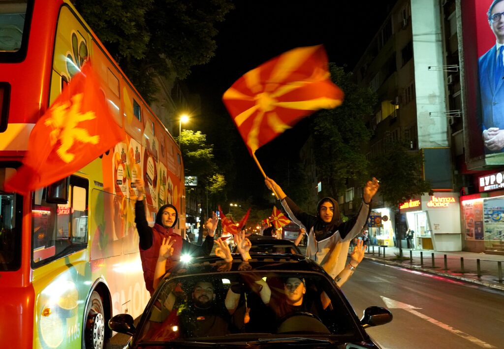 epa11328151 Supporters of the VMRO DPMNE celebrate their victory in both the Parliamentary and second round Presidential elections at the main square in Skopje, Republic of North Macedonia, 08 May 2024.  EPA-EFE/NAKE BATEV