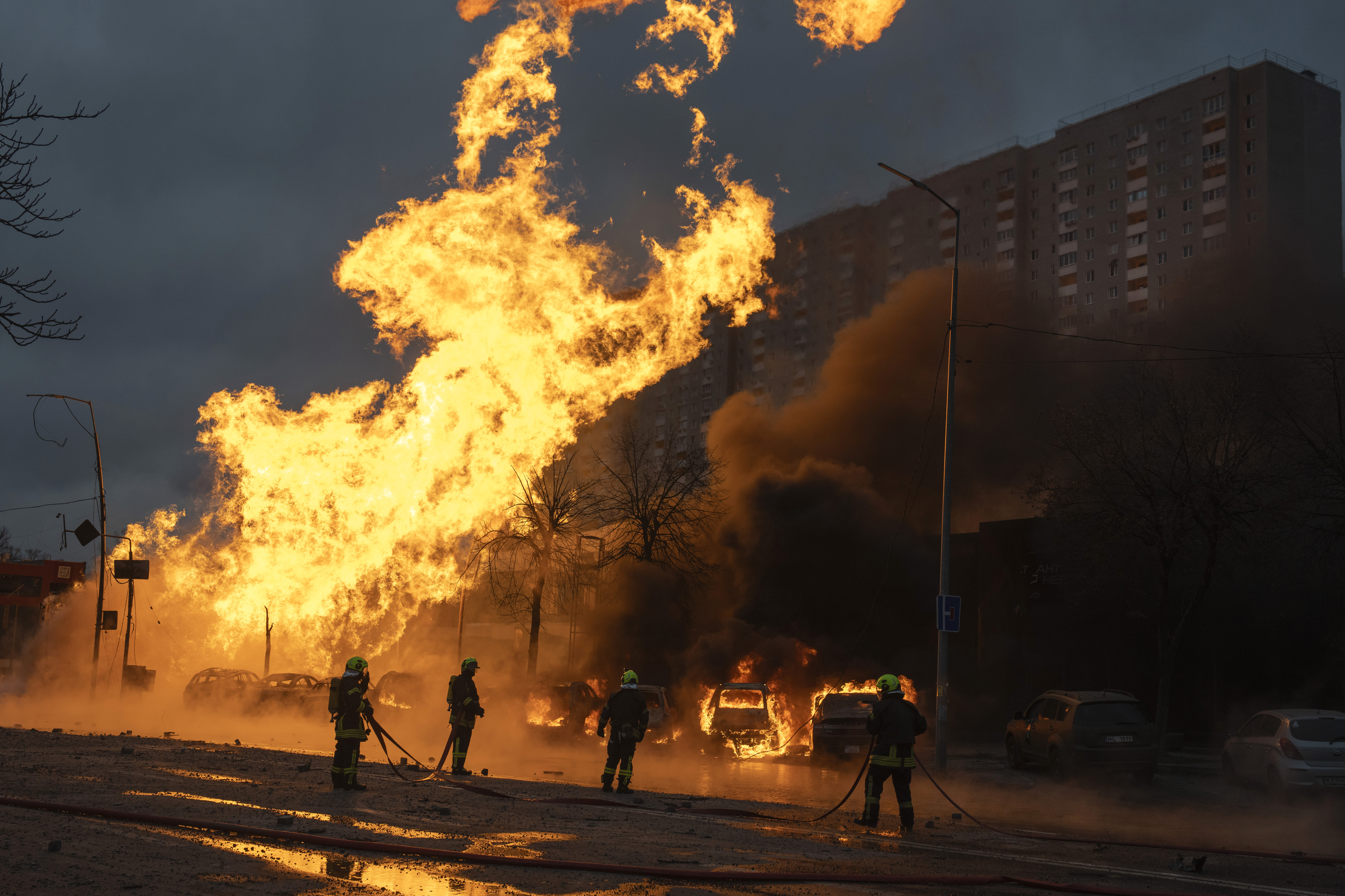 Firefighters work to extinguish a fire after a Russian attack in Kyiv, Ukraine, Tuesday, Jan. 2, 2024. (AP Photo/Efrem Lukatsky)