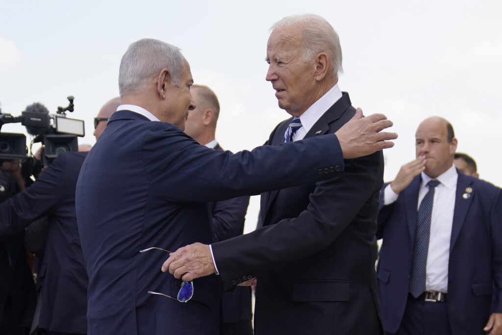 President Joe Biden is greeted by Israeli Prime Minister Benjamin Netanyahu after arriving at Ben Gurion International Airport, Wednesday, Oct. 18, 2023, in Tel Aviv. (AP Photo/Evan Vucci)