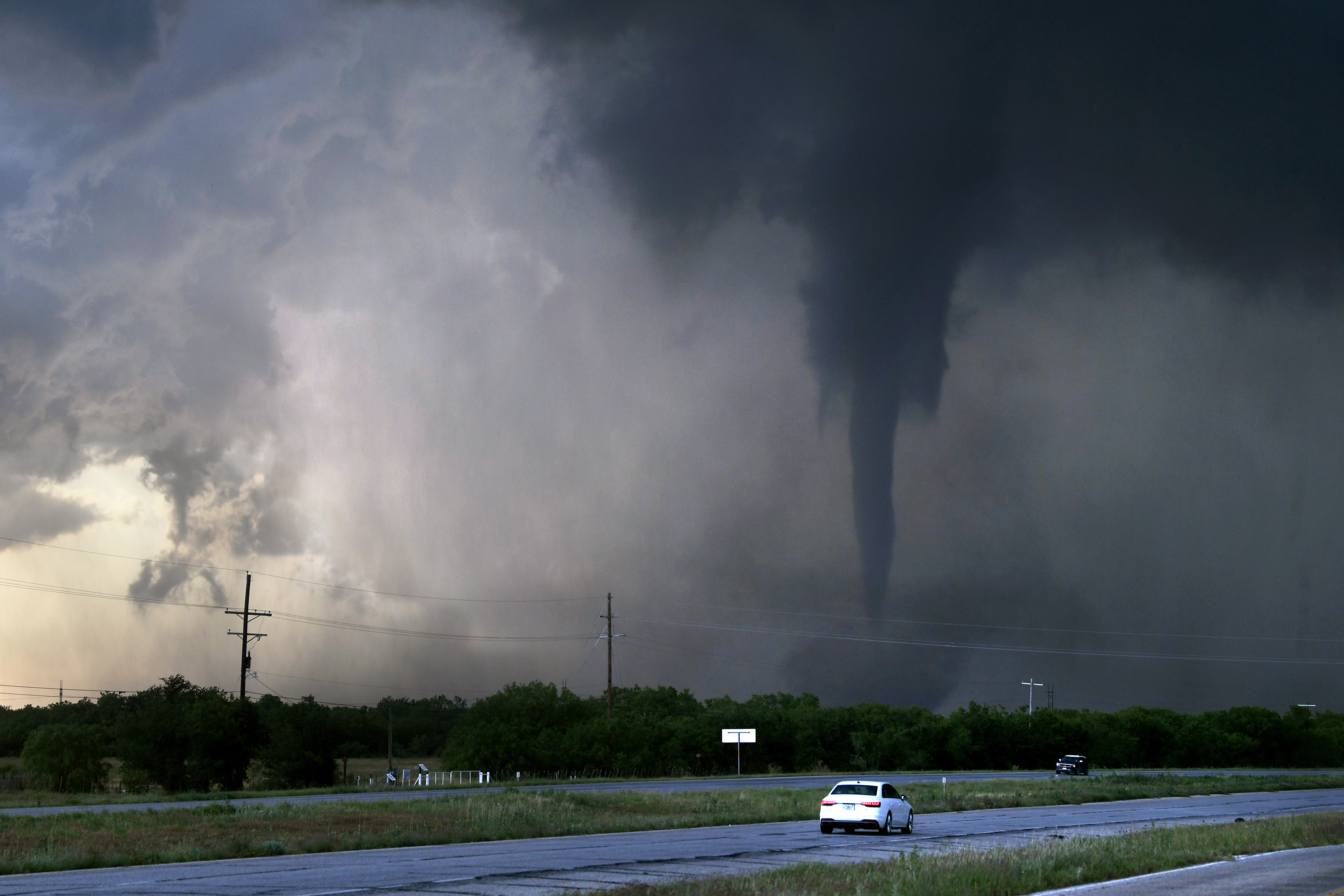 A tornado spins west of Hawley, Texas as cars pass on U.S. 277  on Thursday May 2, 2024.  (Ronald W. Erdrich/The Abilene Reporter-News via AP)