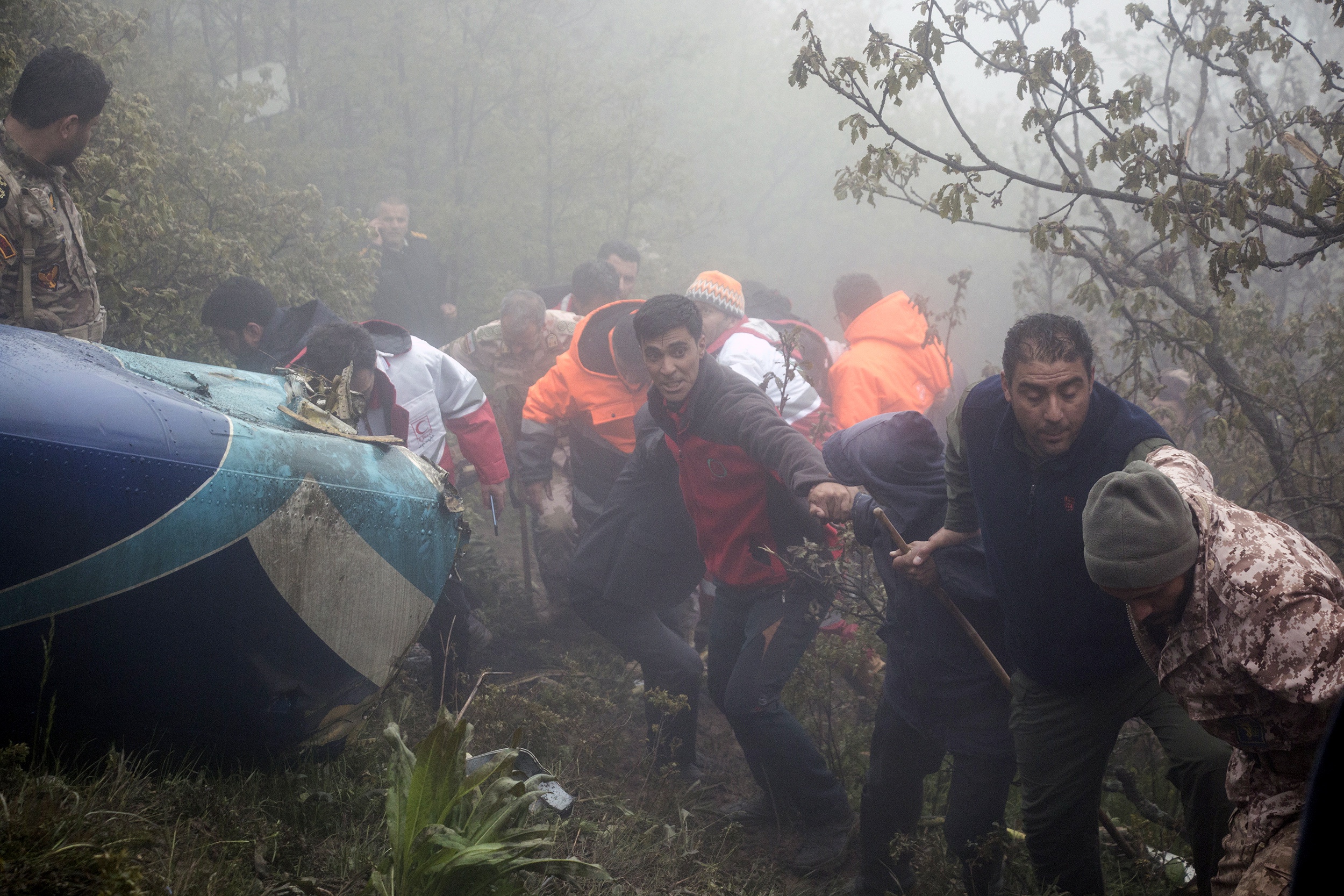 Iranian rescue workers recover bodies of victims of President helicopter crash