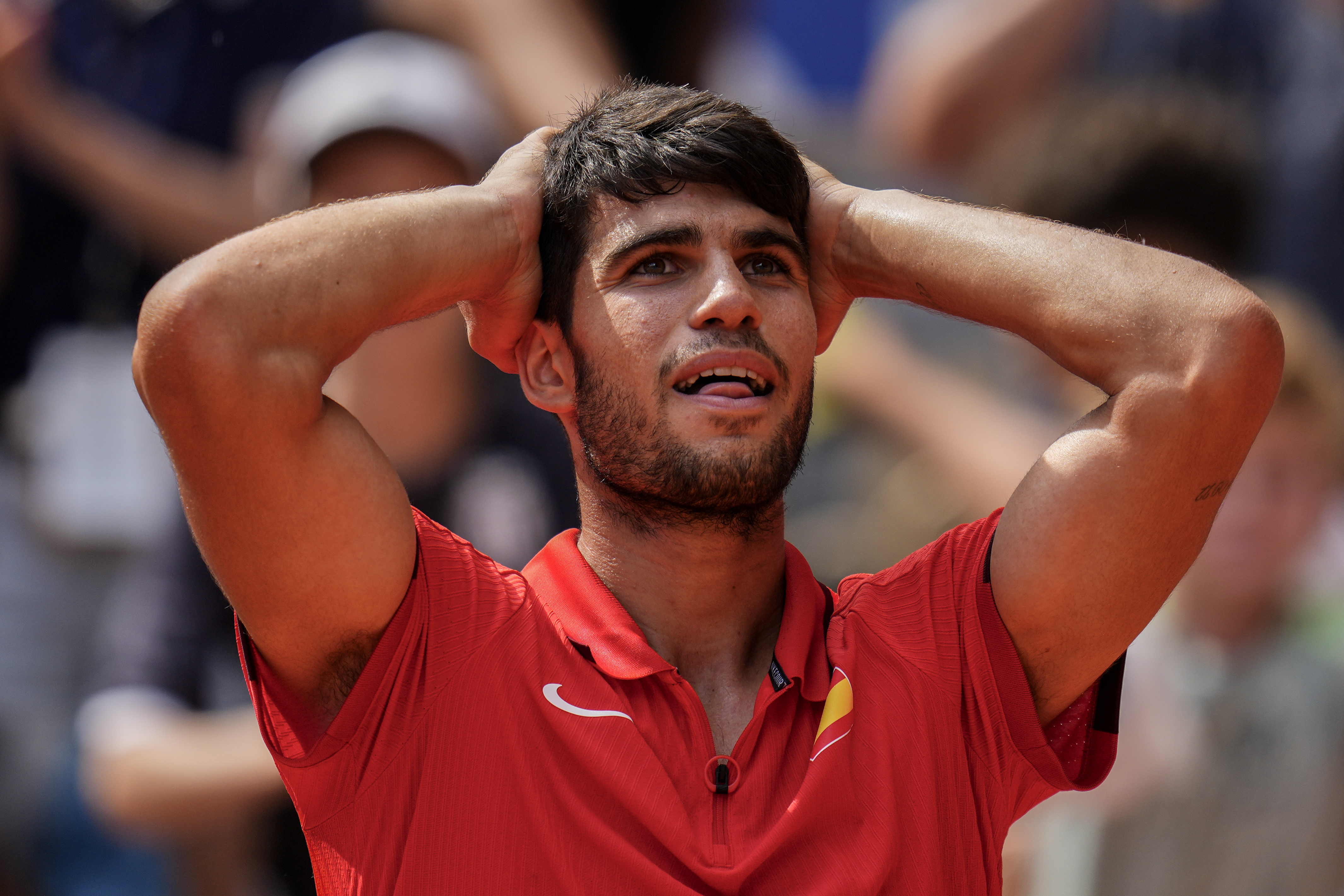 Carlos Alcaraz of Spain celebrates his victory over Tommy Paul, of United States during their men's quarter-final match at the Roland Garros stadium, at the 2024 Summer Olympics, Thursday, Aug. 1, 2024, in Paris, France. (AP Photo/Manu Fernandez)