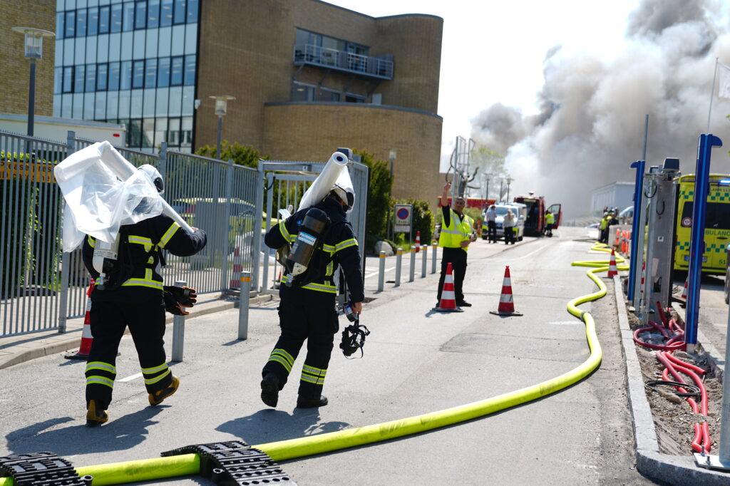 Firefighters work to extinguish a fire at the Novo Nordisk headquarters in Bagsvaerd, near Copenhagen, Denmark, Wednesday, May 22, 2024. (Liselotte Sabroe/Ritzau Scanpix via AP)