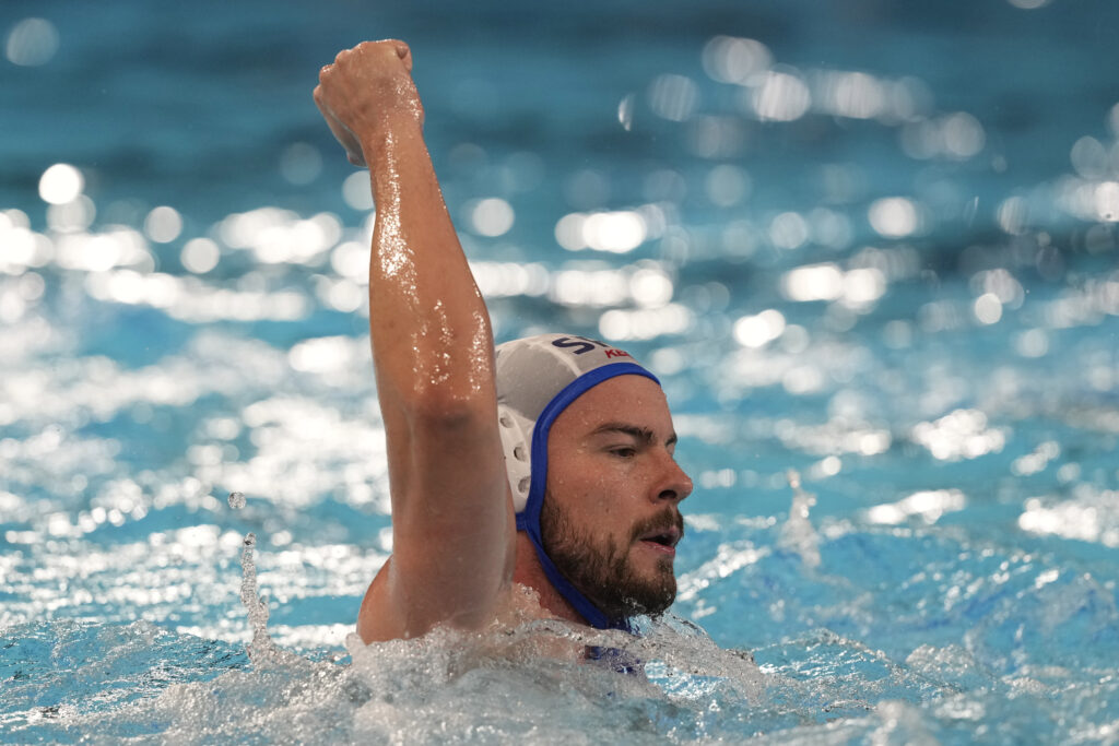 Serbia's Radomir Drasovic celebrates after scoring a goal during a men's water polo Group B preliminary match between Serbia and France, at the 2024 Summer Olympics, Saturday, Aug. 3, 2024, in Saint-Denis, France. (AP Photo/Luca Bruno)