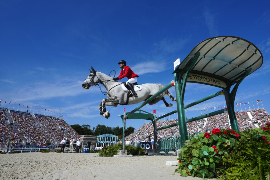Germany's Christian Kukuk rides Checker 47 during the Jumping Individual final at the 2024 Summer Olympics, Tuesday, Aug. 6, 2024, in Versailles, France. (AP Photo/Mosa'ab Elshamy)