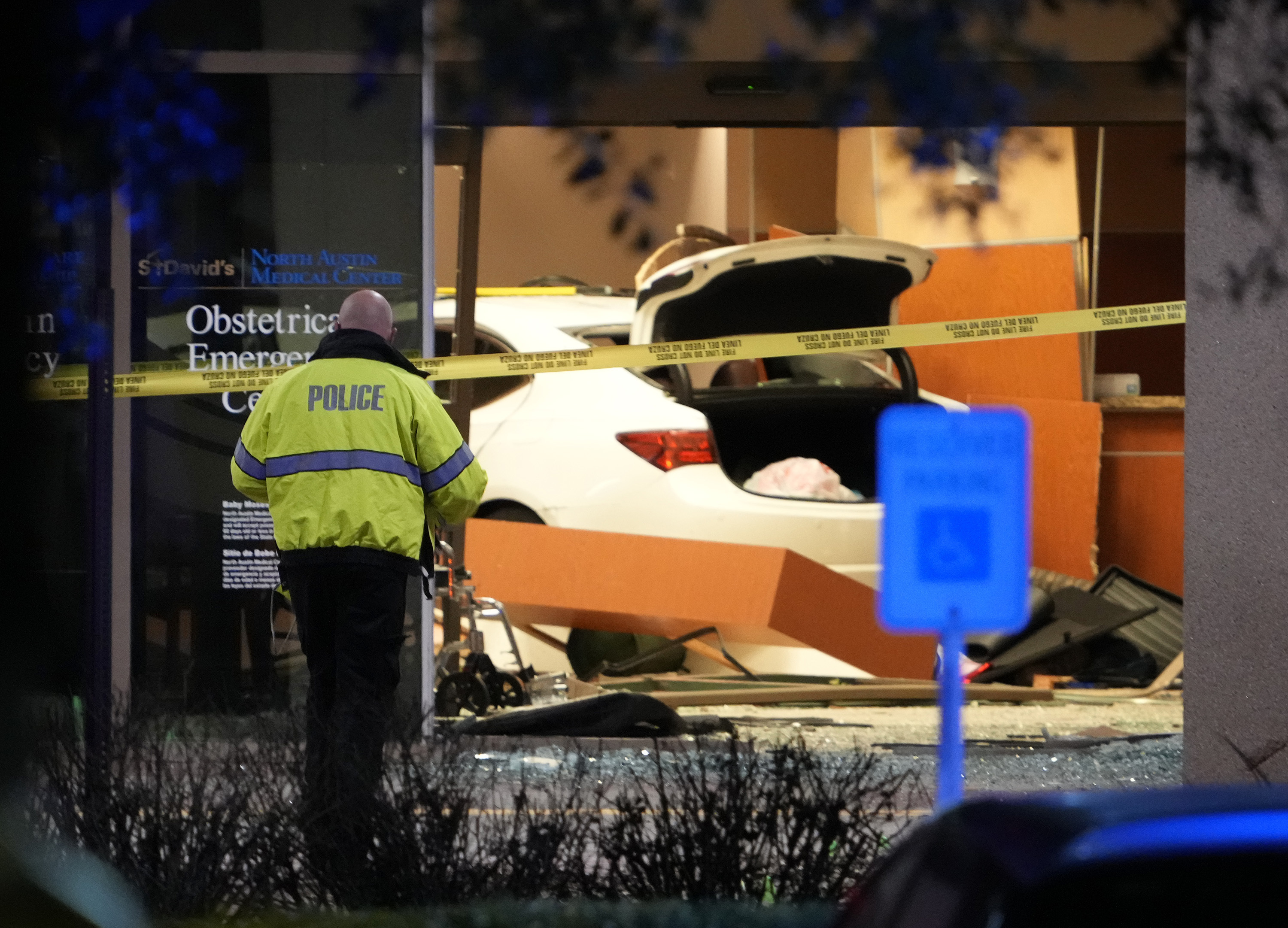 Police investigate after a car crashed into an emergency room at St. David's North Austin Medical Center Medical Center, Tuesday, Feb. 13, 2024, in Austin. (Jay Janner/Austin American-Statesman via AP)