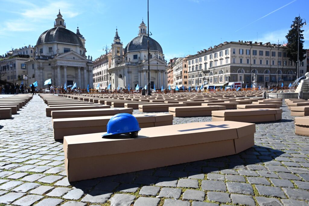 epa11229549 Cardbord coffins are set up at Piazza del Popolo by Italian Labor Union (UIL) during the campaign 'Zero dead at work' to draw public attention to the tragedy of deaths at work, in Rome, Italy, 19 March 2024.  EPA-EFE/MAURIZIO BRAMBATTI