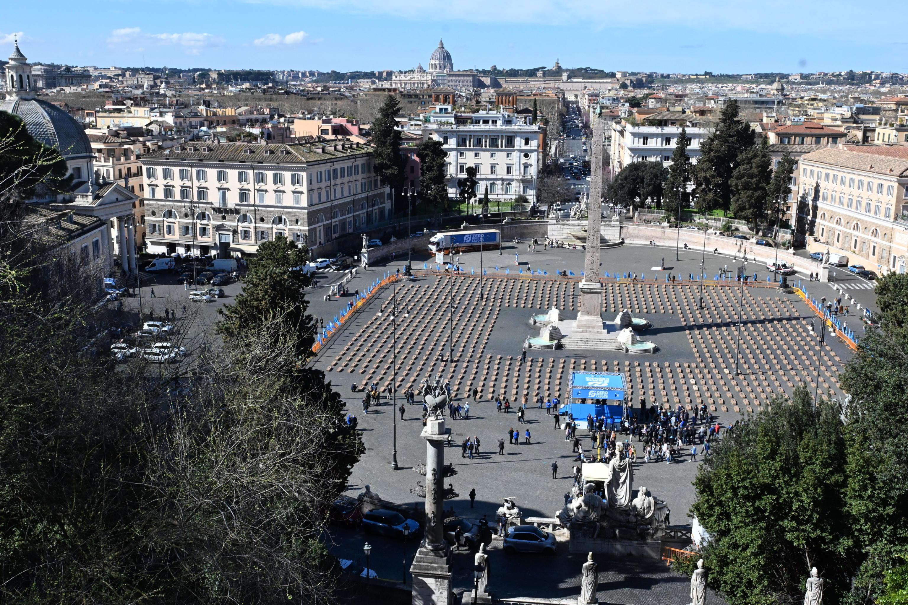 epa11229550 Cardbord coffins are set up at Piazza del Popolo by Italian Labor Union (UIL) during the campaign 'Zero dead at work' to draw public attention to the tragedy of deaths at work, in Rome, Italy, 19 March 2024.  EPA-EFE/MAURIZIO BRAMBATTI