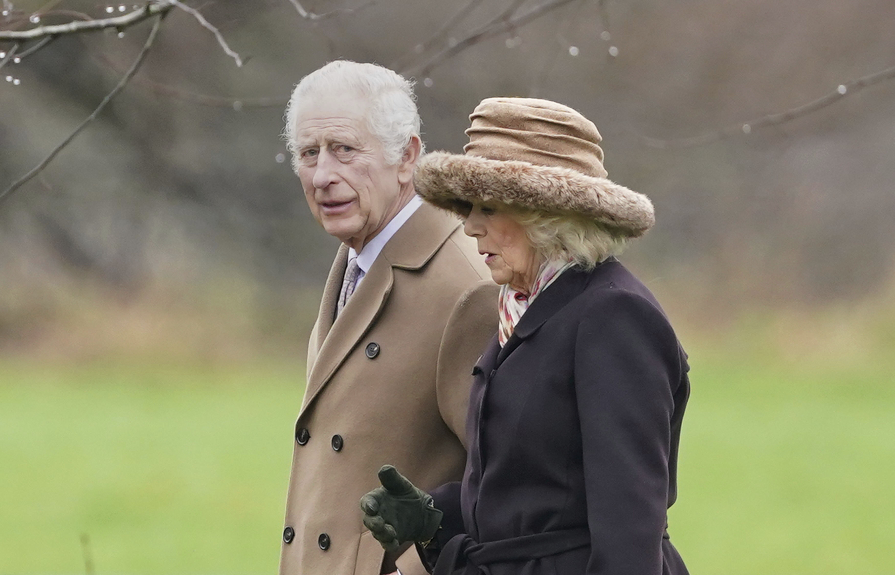 Britain's King Charles III, left, and Queen Camilla leave after attending a Sunday church service at St Mary Magdalene Church in Sandringham, Norfolk, England, Sunday Feb. 18, 2024. (Joe Giddens/PA via AP)