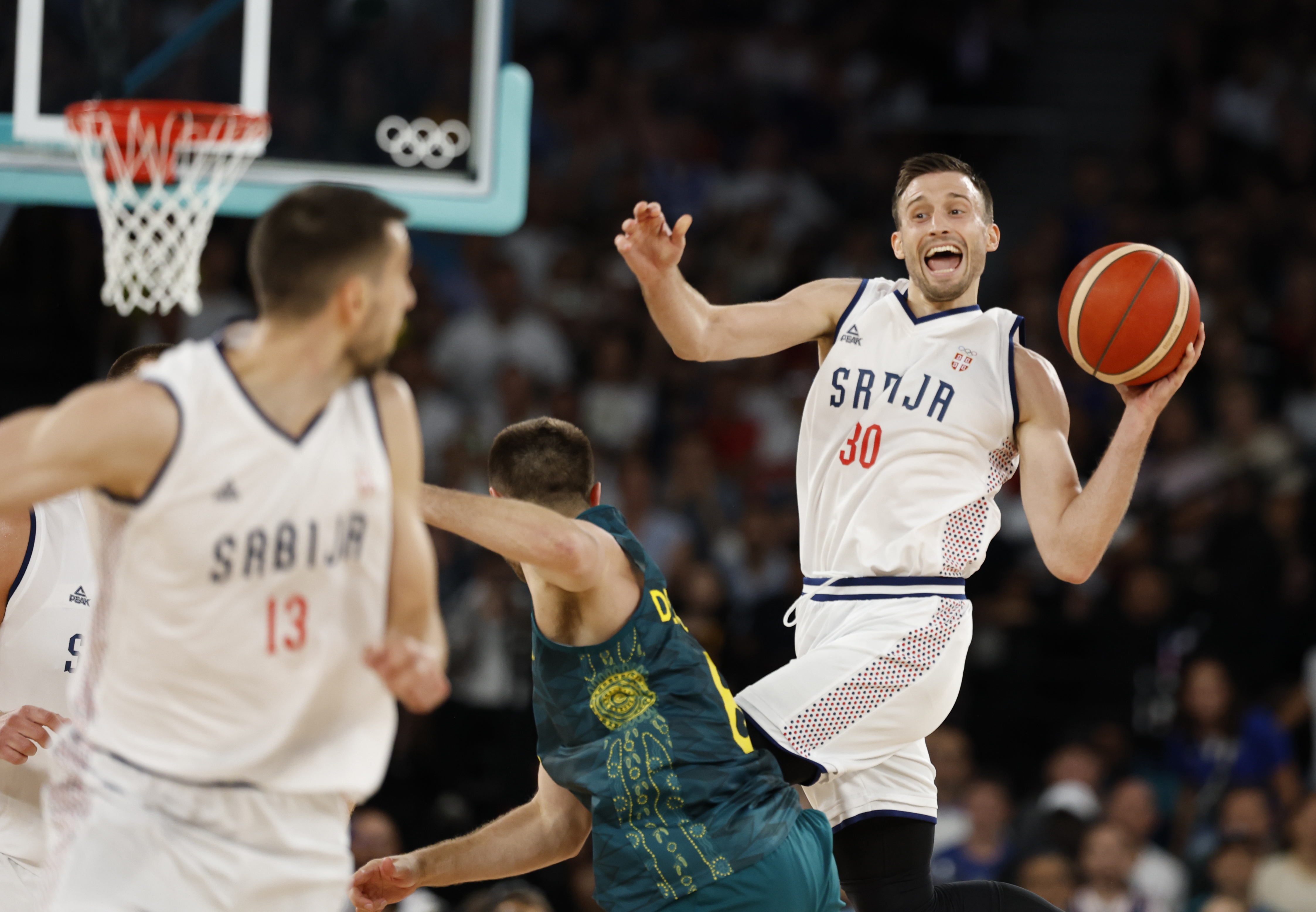 epa11530476 Aleksa Avramovic of Serbia in action during the Men quarterfinal match between Serbia and Australia of the Basketball competitions in the Paris 2024 Olympic Games, at the Bercy Arena in Paris, France, 06 August 2024.  EPA-EFE/CAROLINE BREHMAN