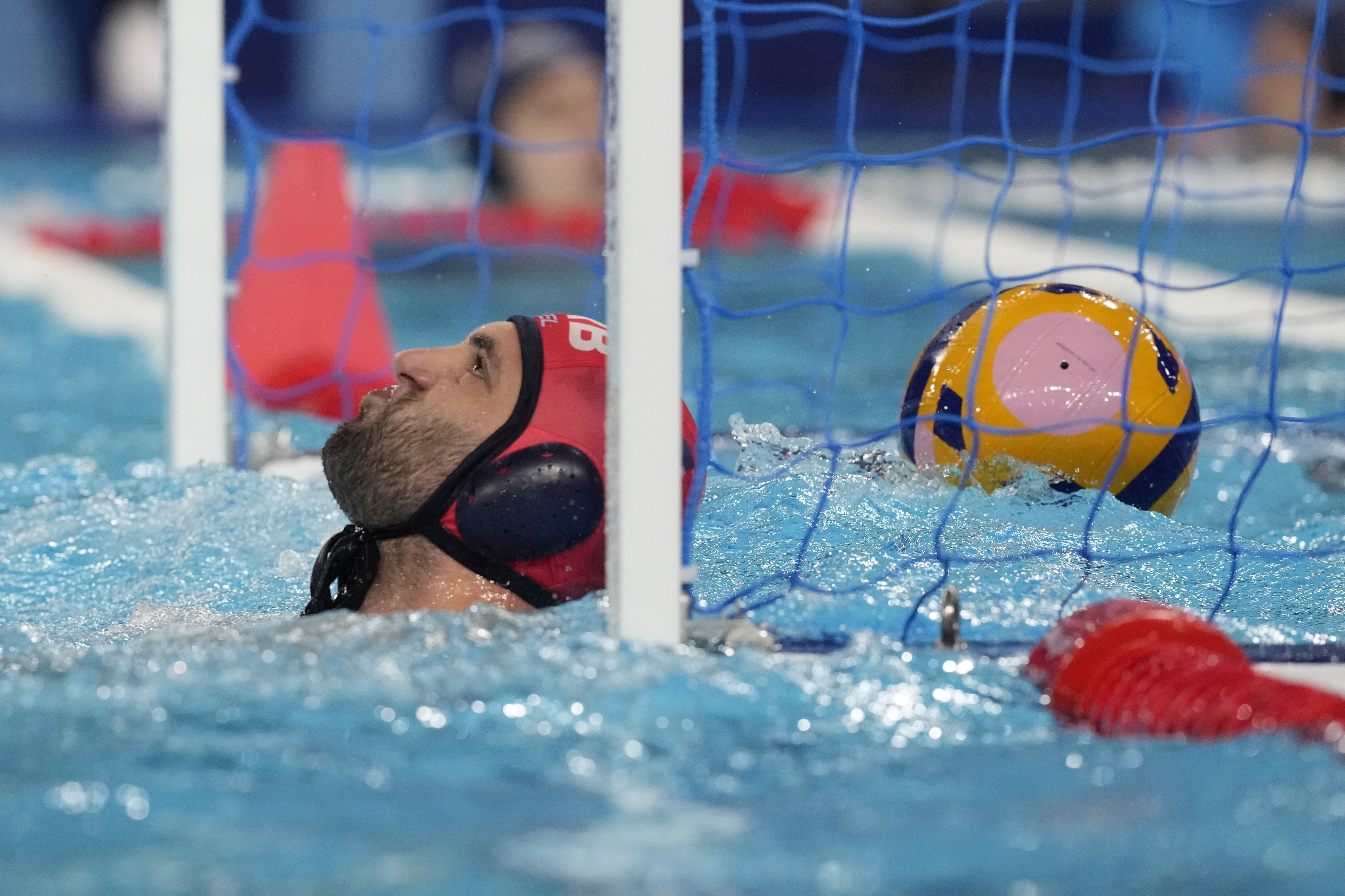 Serbia's goalkeeper Radoslav Filipovic reacts after he fails to stop a goal during a men's water polo Group B preliminary match between Australia and Serbia at the 2024 Summer Olympics, Tuesday, July 30, 2024, in Saint-Denis, France. (AP Photo/Luca Bruno)