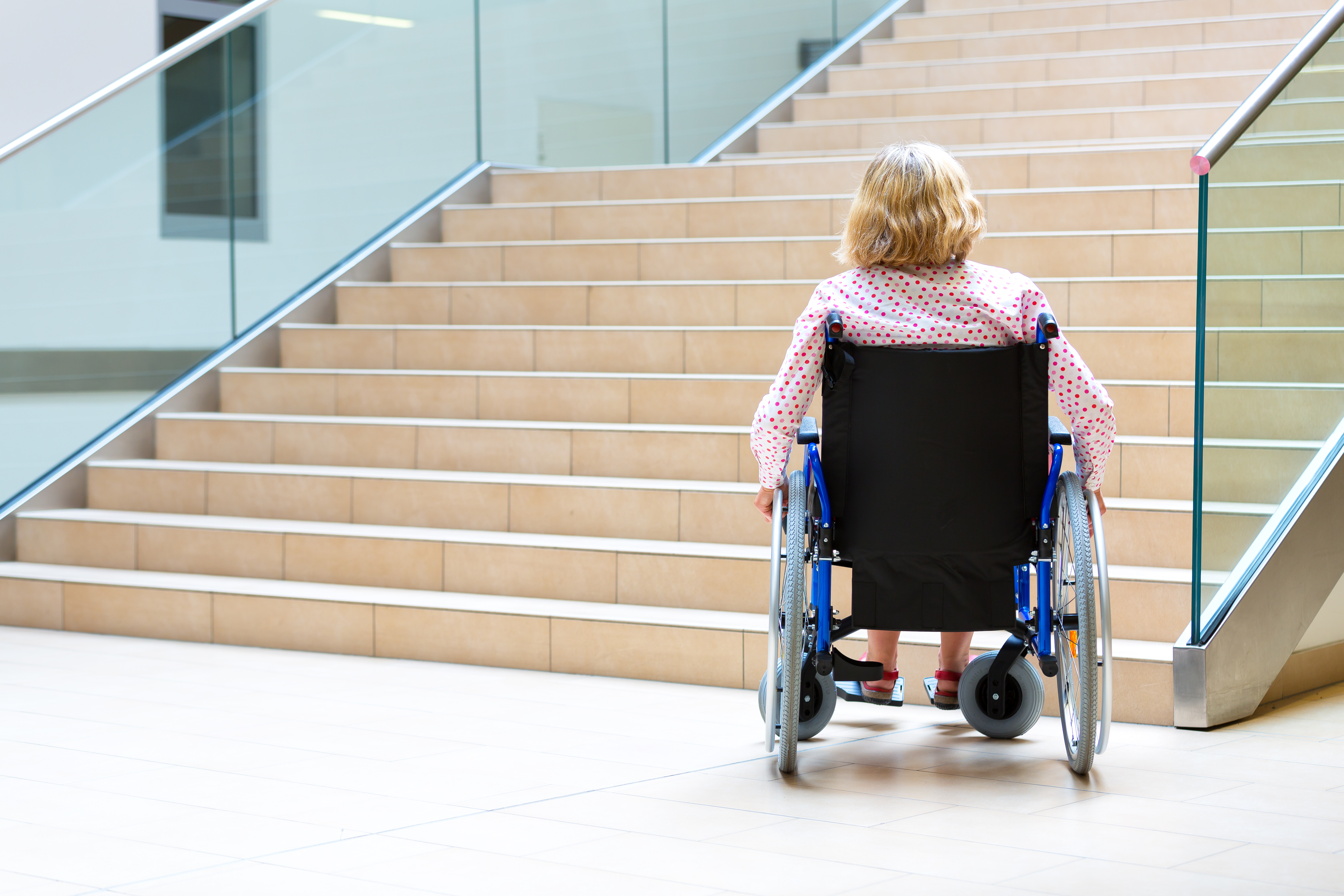 Woman,On,Wheelchair,Standing,Before,Stairs,Looking,Up,For,Help