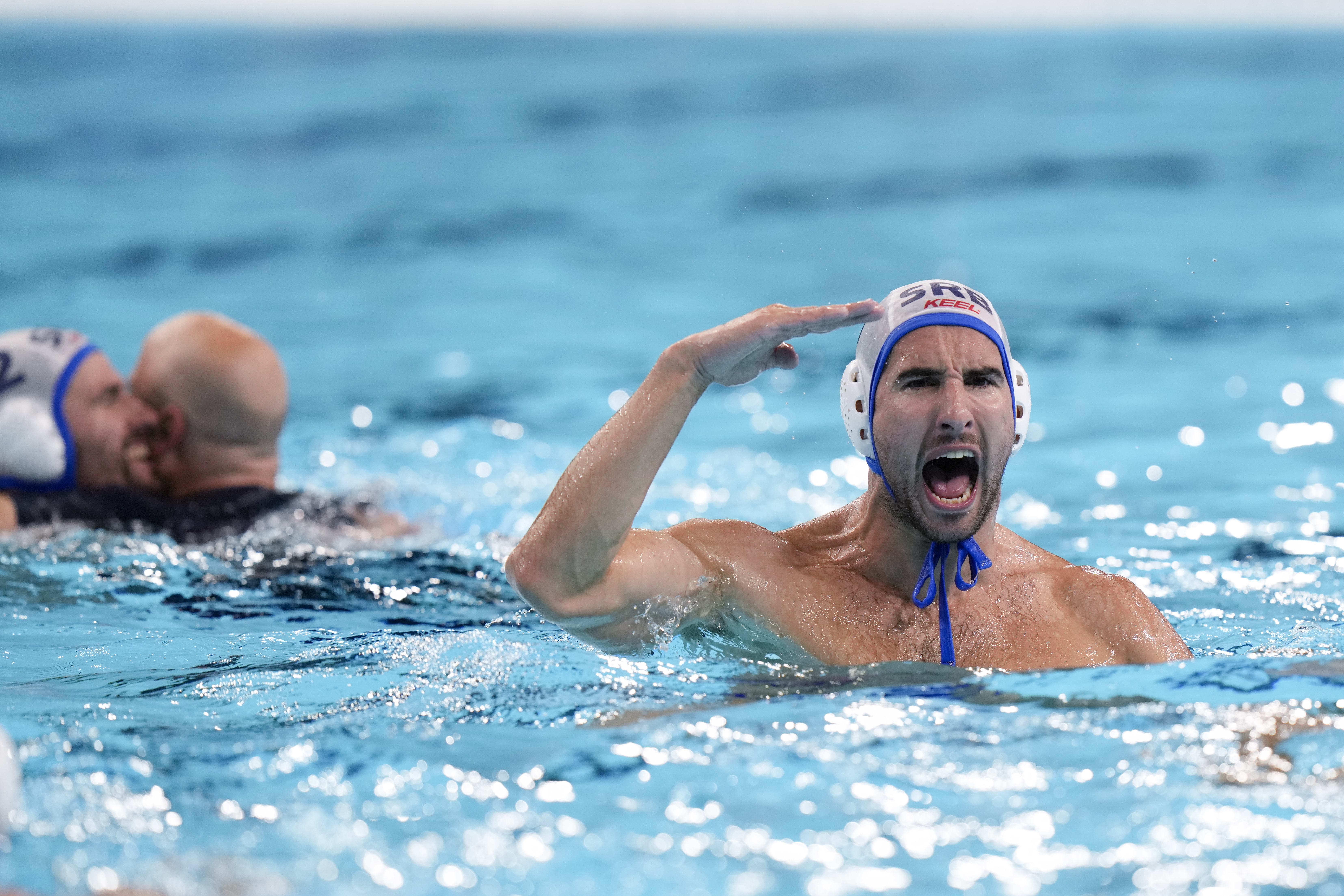 Serbia's Strahinja Rasovic celebrates winning the men's water polo gold medal match against Croatia, at the 2024 Summer Olympics, Sunday, Aug. 11, 2024, in Paris, France. (AP Photo/Luca Bruno)