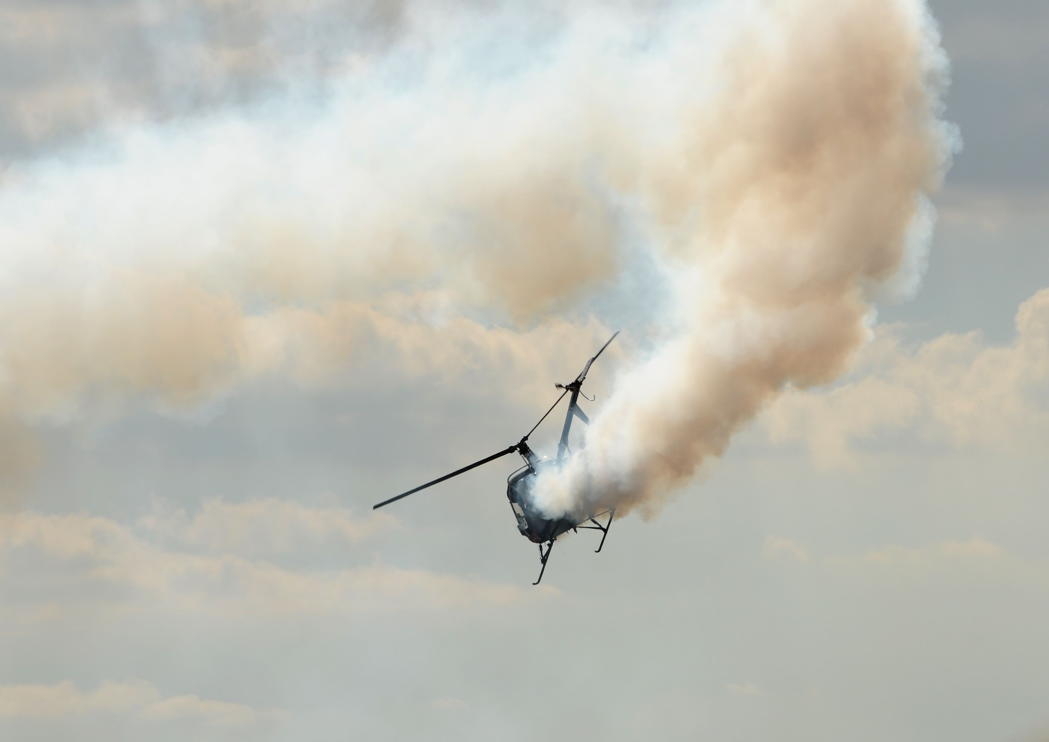 Small,Helicopter,Landing,With,Engine,Fire