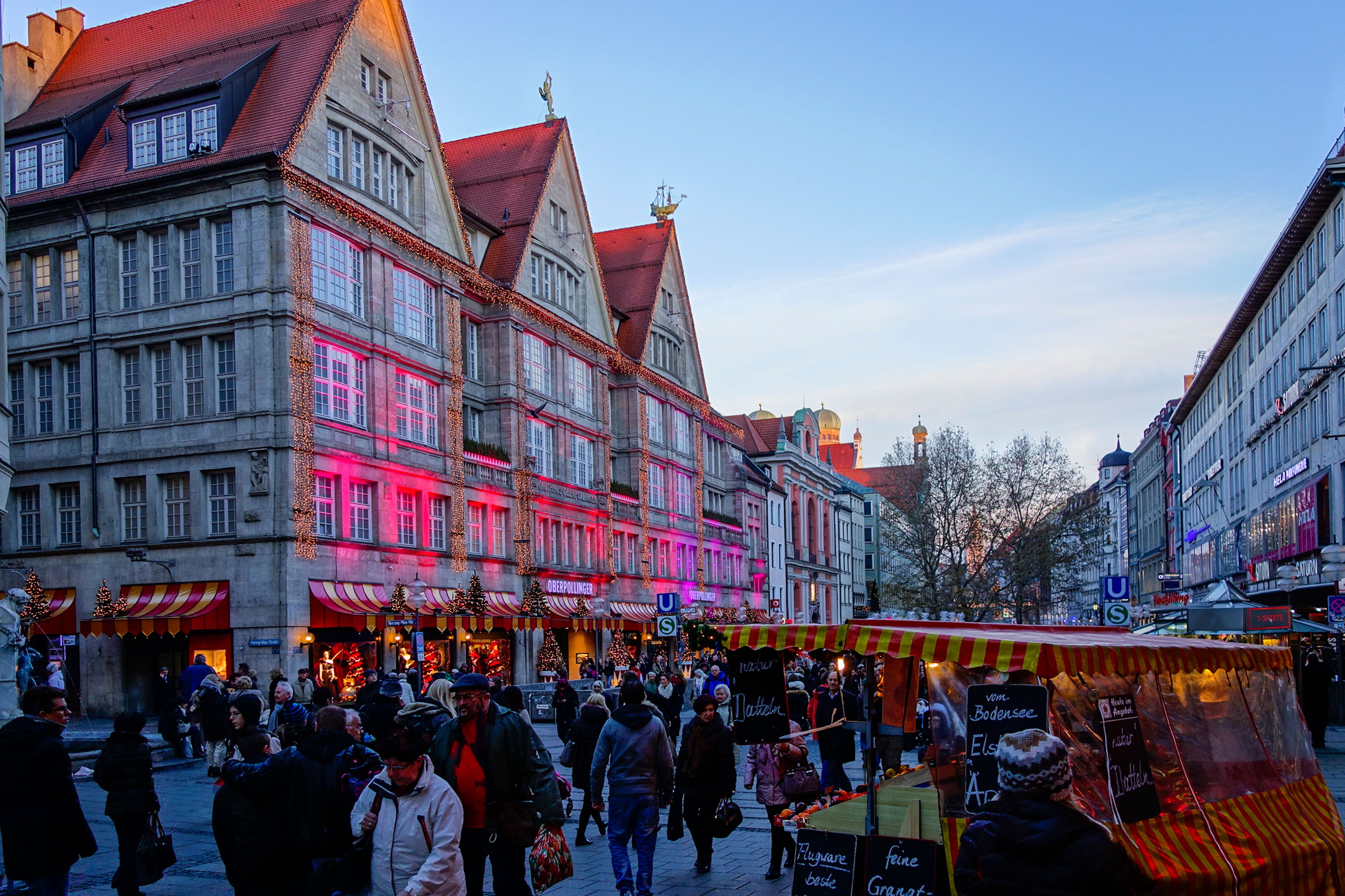 Christmas shopping, colorful illuminated facade of the department store Oberpollinger in the Neuhauser Street in Munich