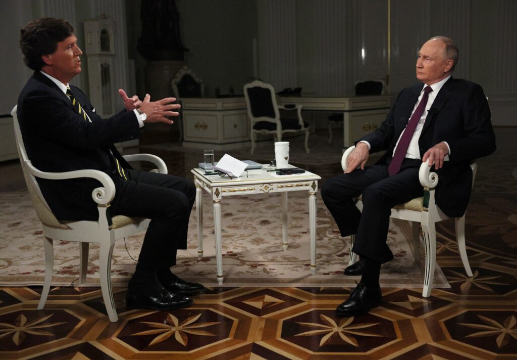 epa11138491 Russian President Vladimir Putin (R) attends an interview with US journalist Tucker Carlson at the Kremlin in Moscow, Russia, 06 February 2024 (issued 09 February 2024).  EPA-EFE/GAVRIIL GRIGOROV/SPUTNIK/KREMLIN POOL MANDATORY CREDIT