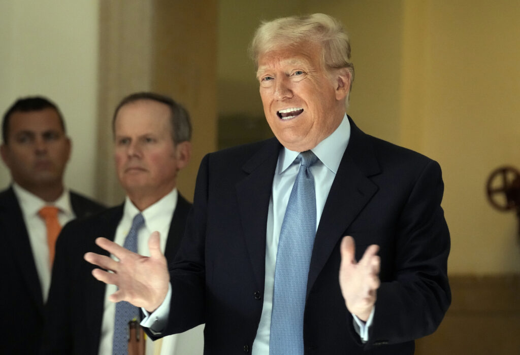 Former President Donald Trump comments to the media during a break of his civil business fraud trial at New York Supreme Court, Wednesday, Oct. 18, 2023, in New York. (AP Photo/Seth Wenig)
