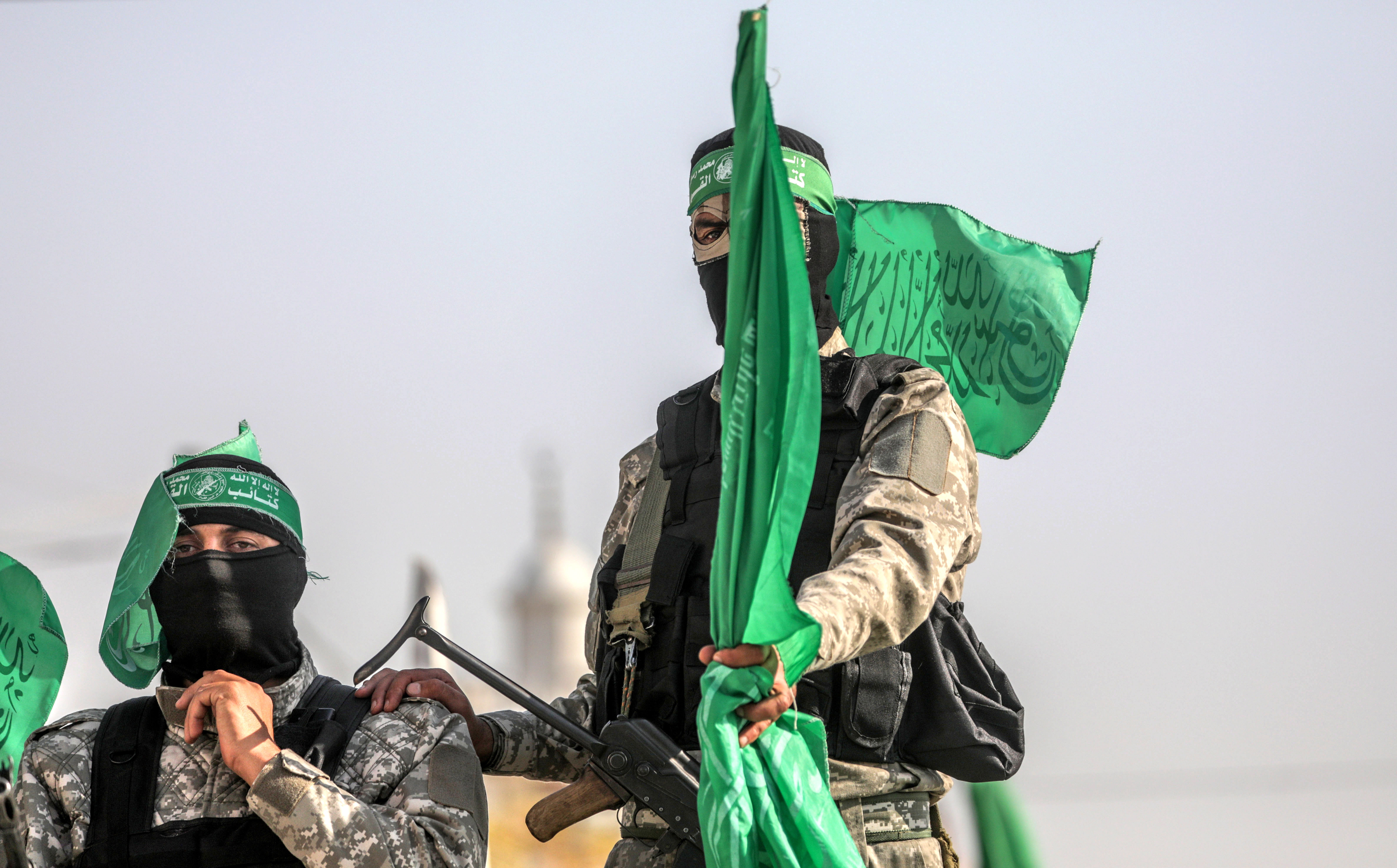 epa07988981 Fighters of Ezz al-Din al-Qassam brigades, the military wing of Hamas movement march during a military parade in the east Khan Younis town, southern Gaza Strip, 11 November 2019.  EPA-EFE/MOHAMMED SABER