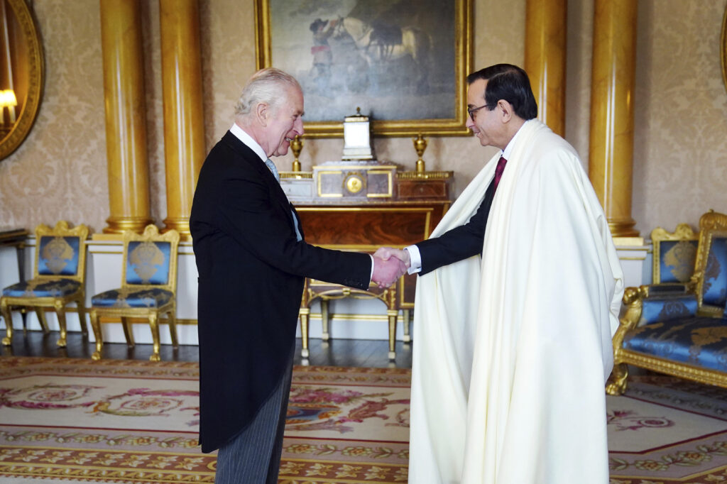 The Ambassador of Algeria Nourredine Yazid, right, presents his credentials to Britain's King Charles III during a private audience at Buckingham Palace, London, Wednesday March 6, 2024. (Victoria Jones/Pool via AP)