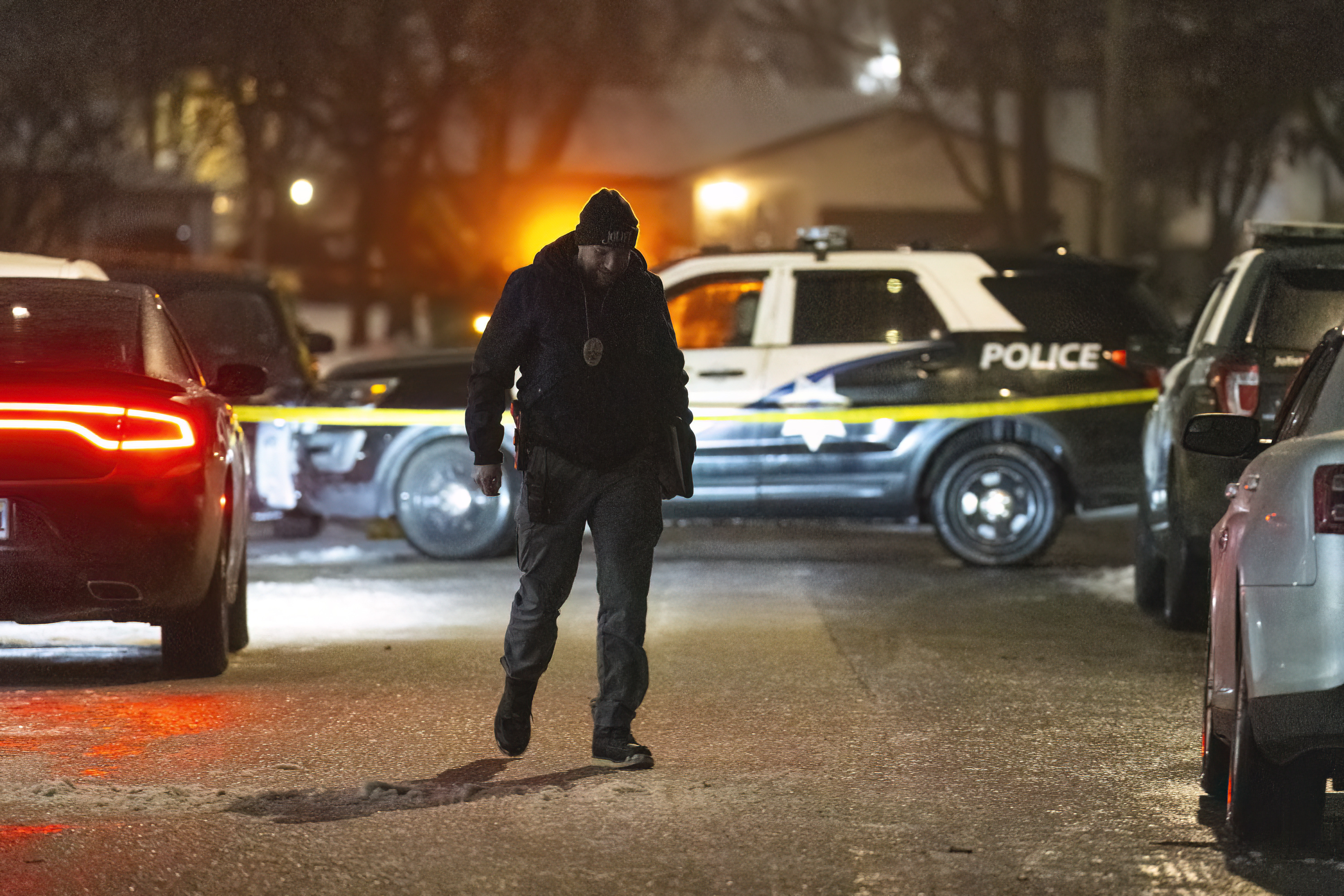 Police work a scene, Monday, Jan. 22, 2024, in Joliet, Ill., after multiple people were shot and killed over two days at three locations in the Chicago suburbs. (Tyler Pasciak LaRiviere/Chicago Sun-Times via AP)