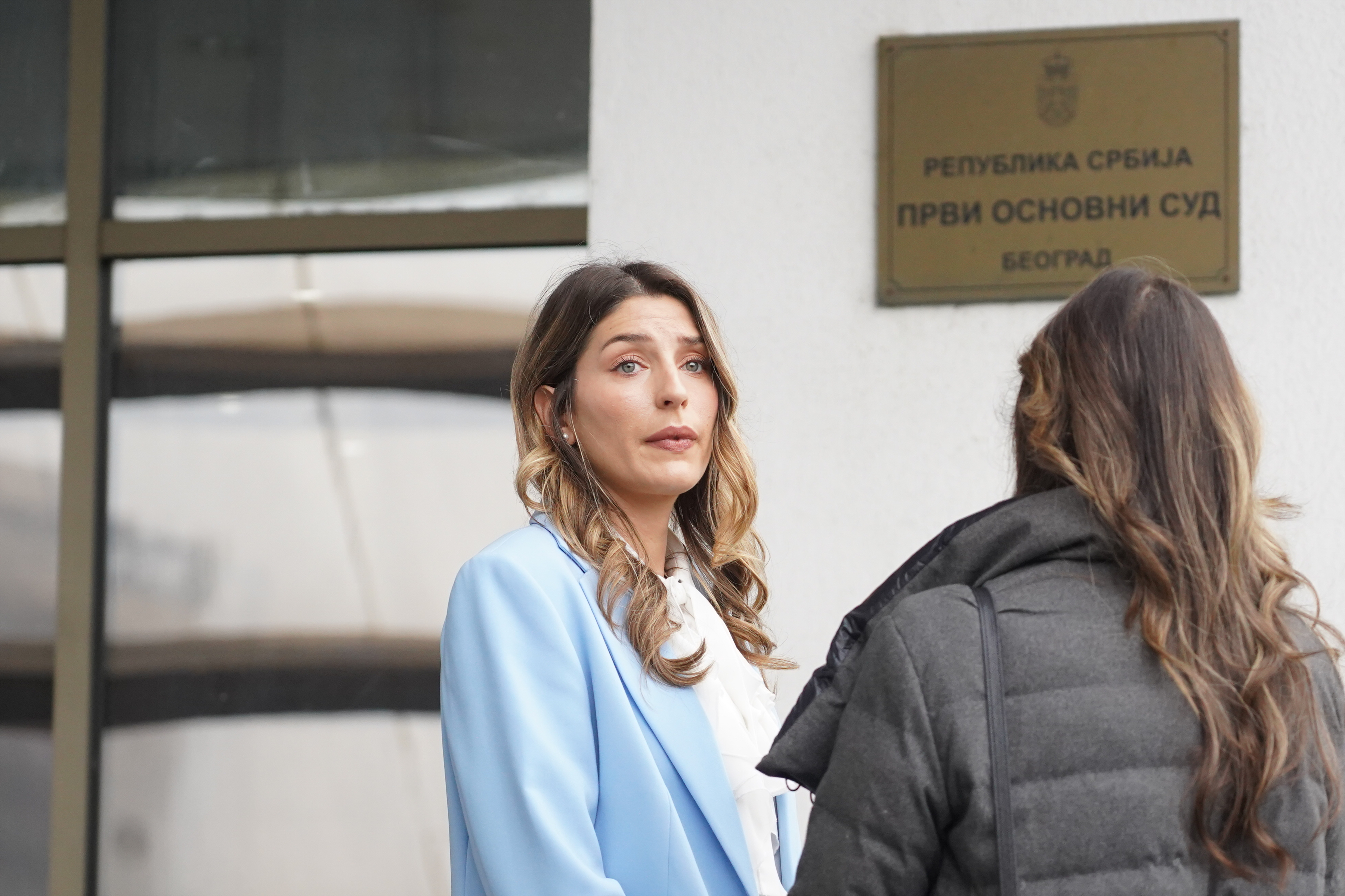 Andjela Jovanovic leaves the First Basic Court, where the charges against Branislav Lecic were filed "for injury to honor and reputation" because she refused to play with him in the television series "Radio Mileva".