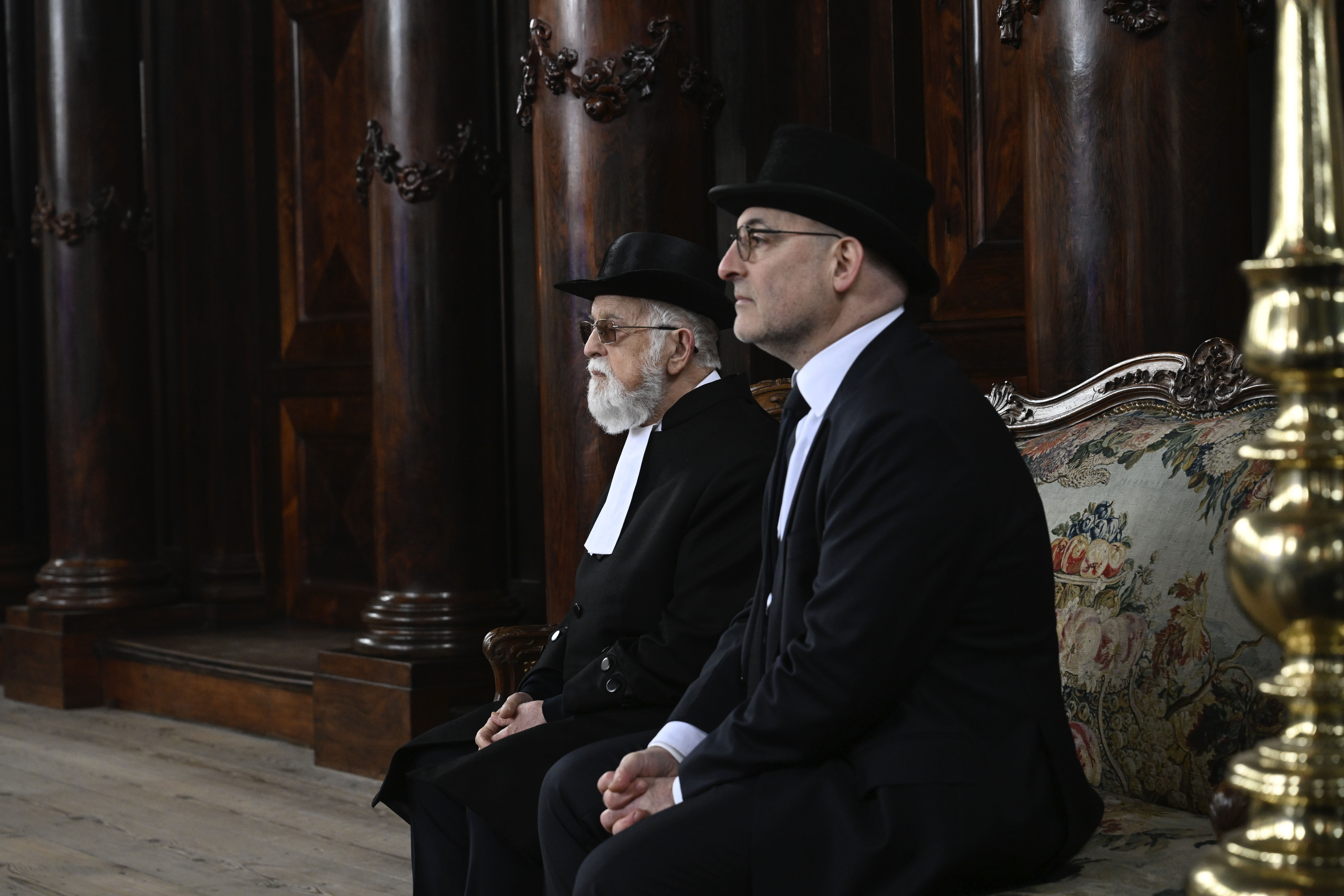 Two men are seated at the Portuguese Synagogue during a ceremony marking the opening of the new National Holocaust Museum in Amsterdam, Netherlands, Sunday, March 10, 2024. (Patrick van Emst/Pool Photo via AP)