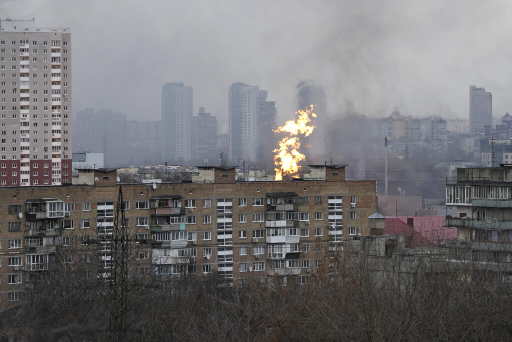 Fire and smoke rises in a residential area after a Russian attack in Kyiv, Ukraine, Tuesday, Jan. 2, 2024. (AP Photo/Efrem Lukatsky)