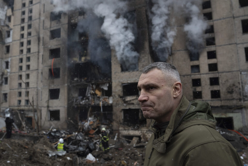 Mayor of Kyiv Vitali Klitschko inspects the damage near a residential building damaged by a Russian rocket attack, in Kyiv, Ukraine, Tuesday, Jan. 2, 2024. (AP Photo/Evgeniy Maloletka)