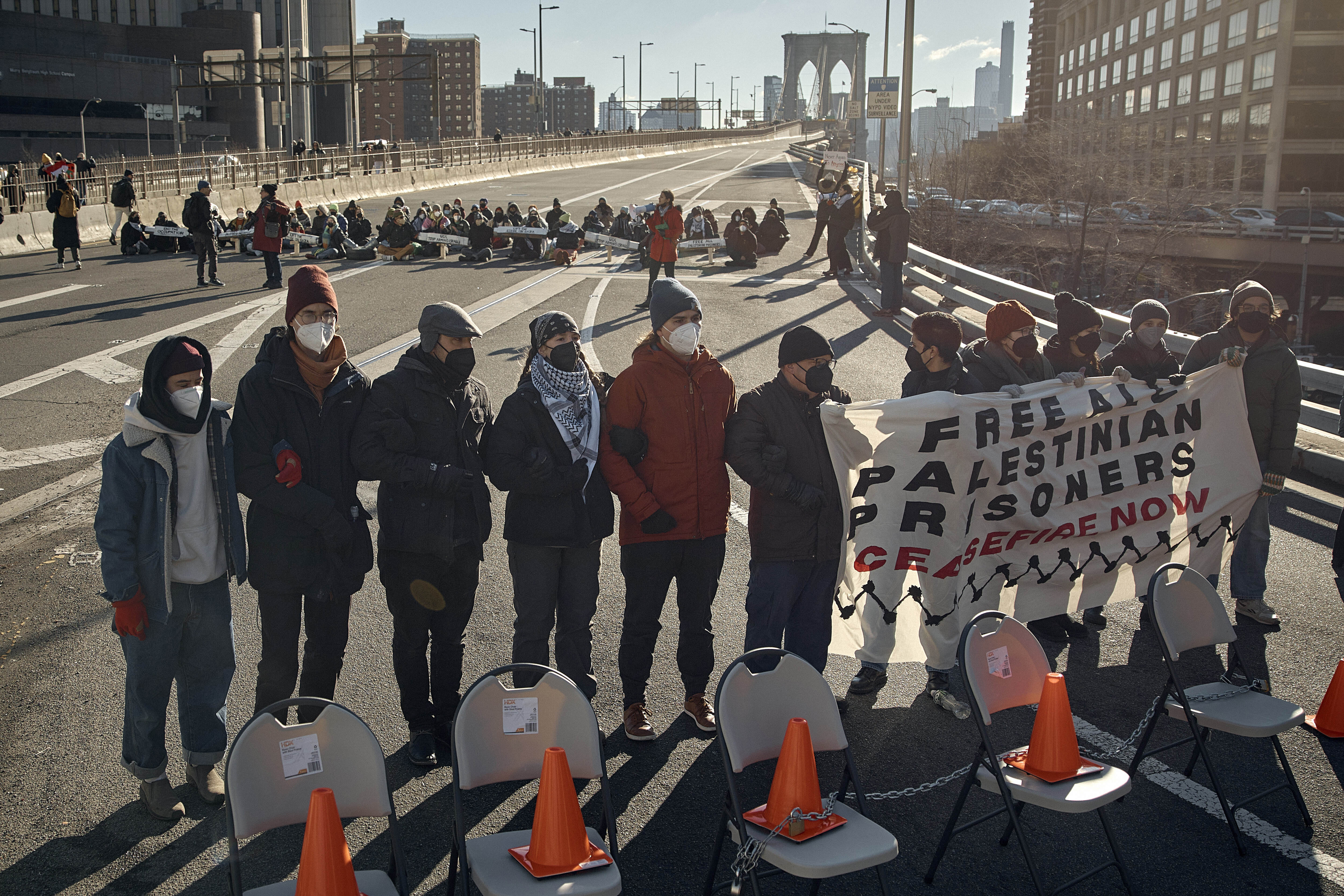 Protesters block Brooklyn Bridge during a pro-Palestinian activity demanding the cease-fire on the Israel-Palestinian conflict on Monday, Jan. 8, 2024, in New York. (AP Photo/Andres Kudacki)