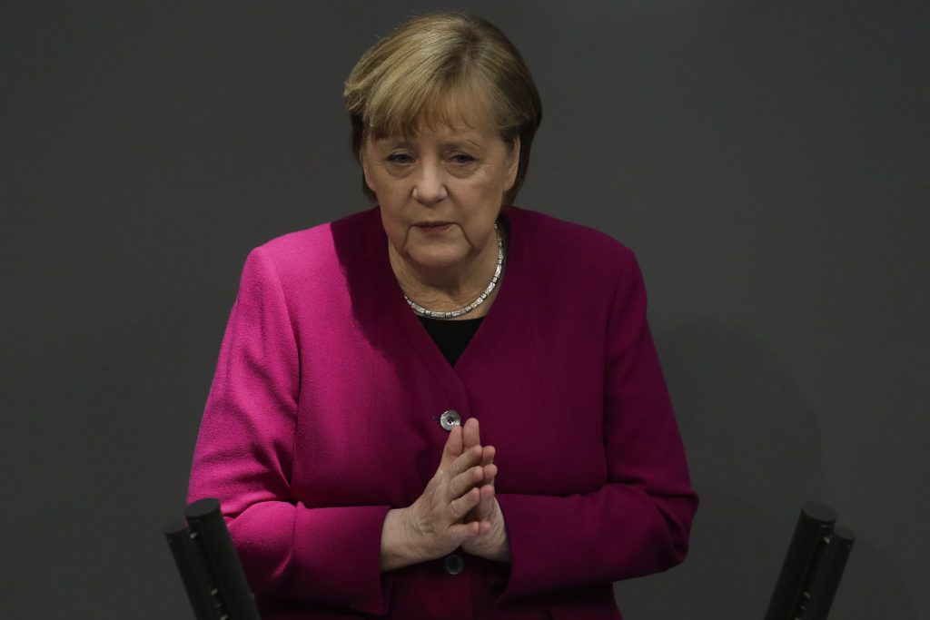 German Chancellor Angela Merkel addresses the German parliament Bundestag ahead of an European Union summit at the Reichstag building in Berlin, Germany, Thursday, March 25, 2021. (AP Photo/Markus Schreiber)