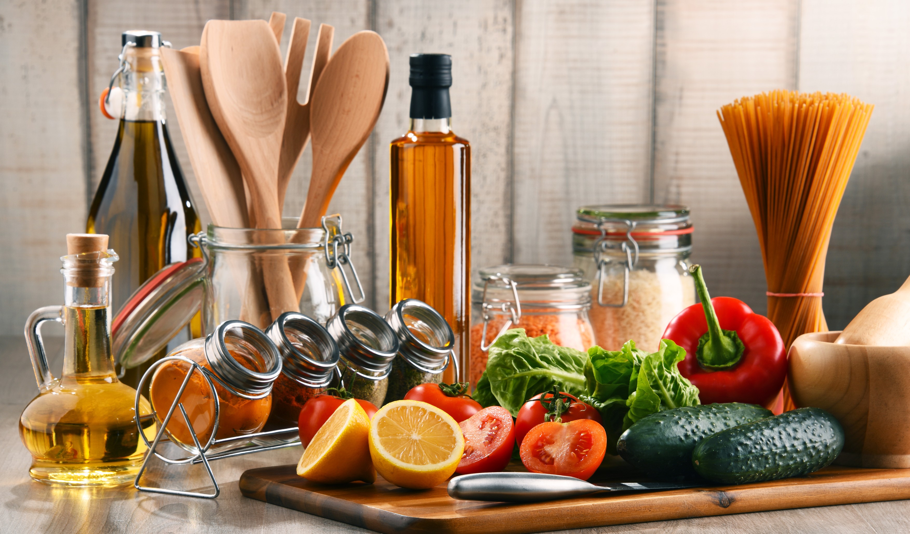 Composition with assorted food products and kitchen utensils