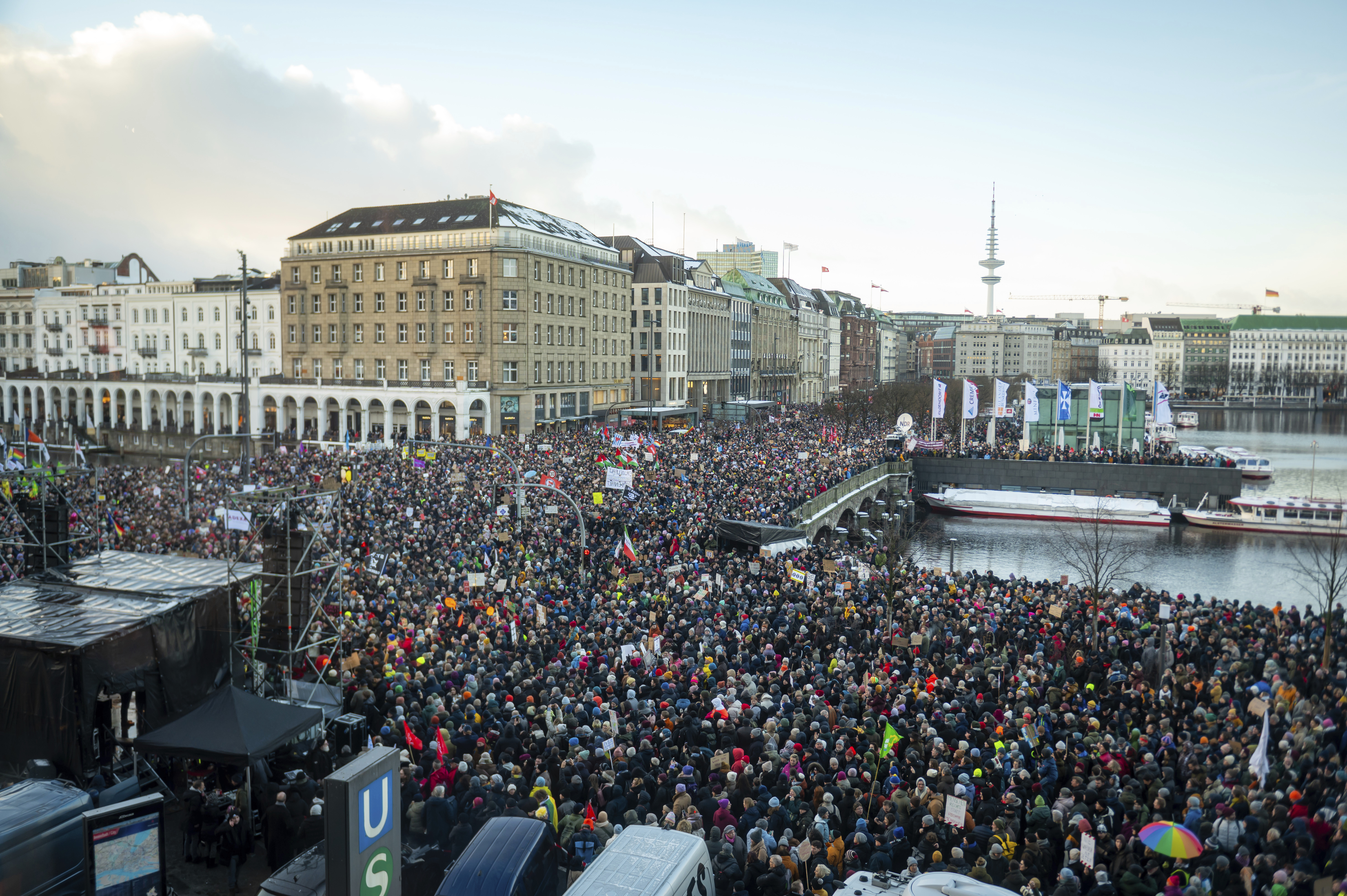 Demonstrators protest against the right-wing extremist activities as they gather in the Jungfernstieg and surrounding areas in Hamburg, Germany, Friday Jan. 19, 2024. (Jonas Walzberg/dpa via AP)