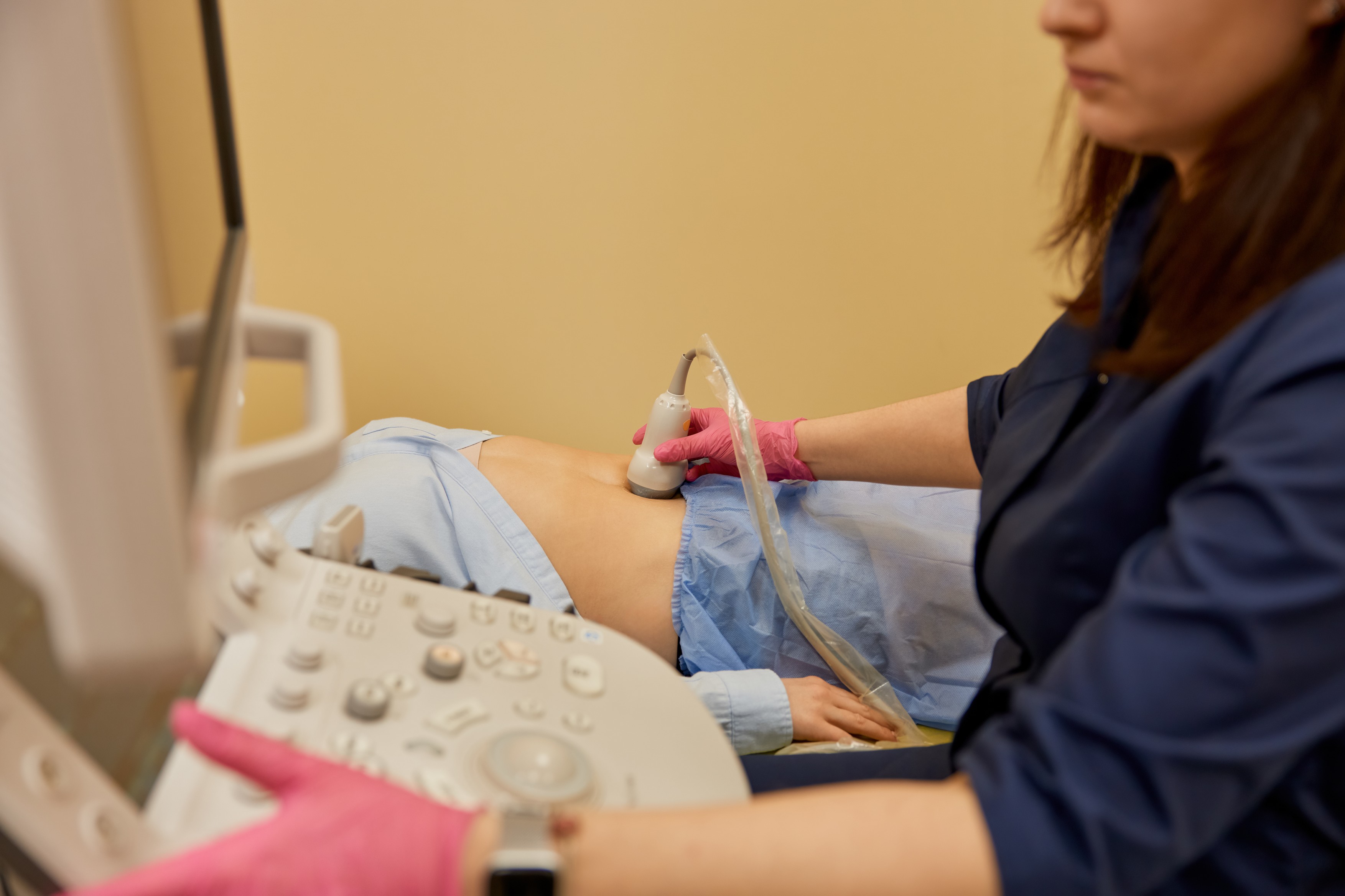 Gynecologist making ultrasonic diagnostic test for patient