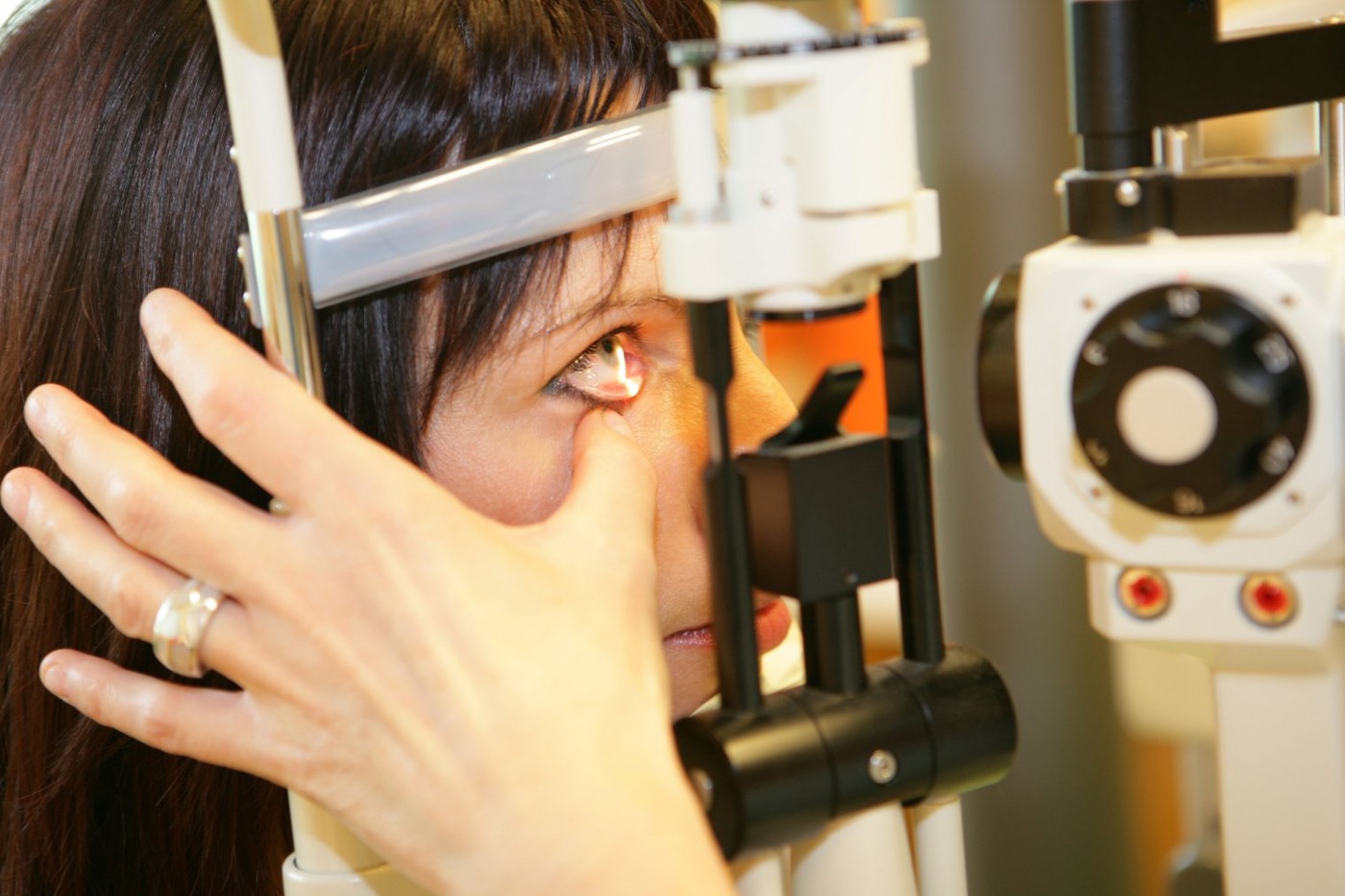 optometrist giving eye exam