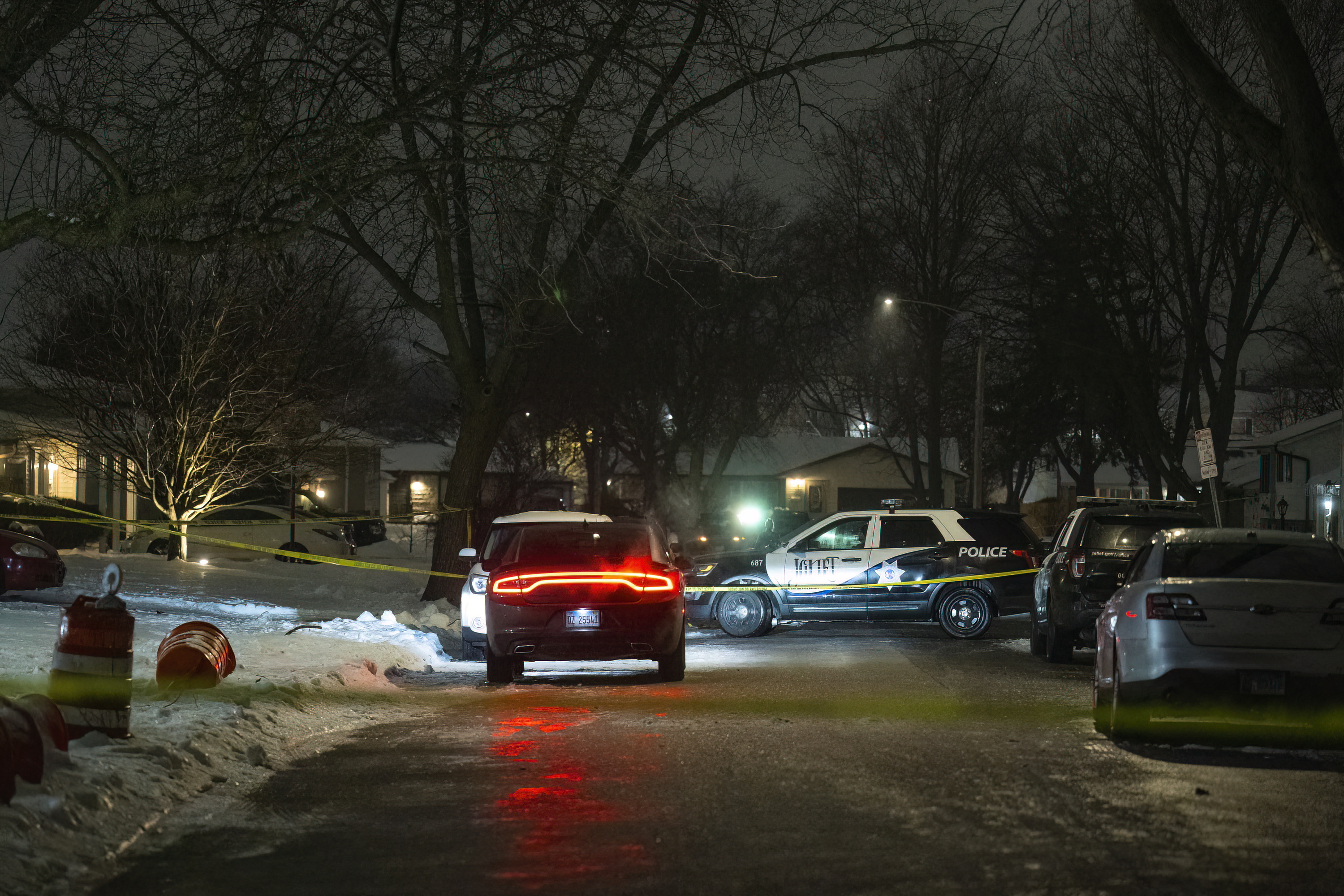 Police work a scene, Monday, Jan. 22, 2024, in Joliet, Ill., after multiple people were shot and killed over two days at three locations in the Chicago suburbs. (Tyler Pasciak LaRiviere/Chicago Sun-Times via AP)