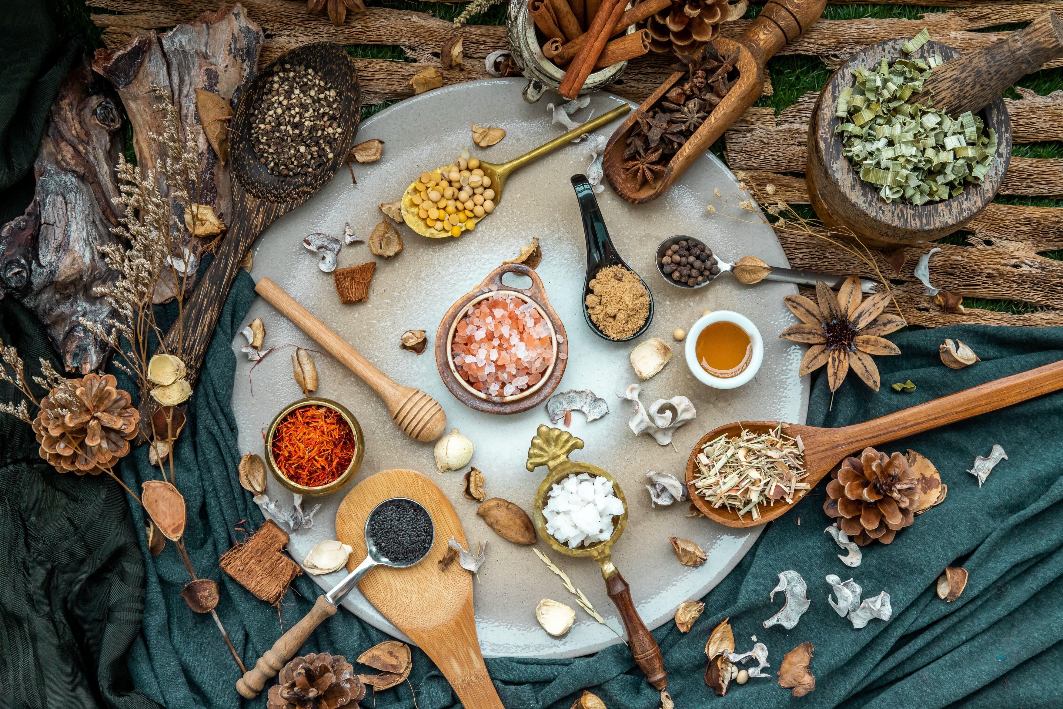 Various spices and herbs in rustic style with honey on balck background. Natural herbs medicine, Organic herbal and healthy concept, Top view, Selecti